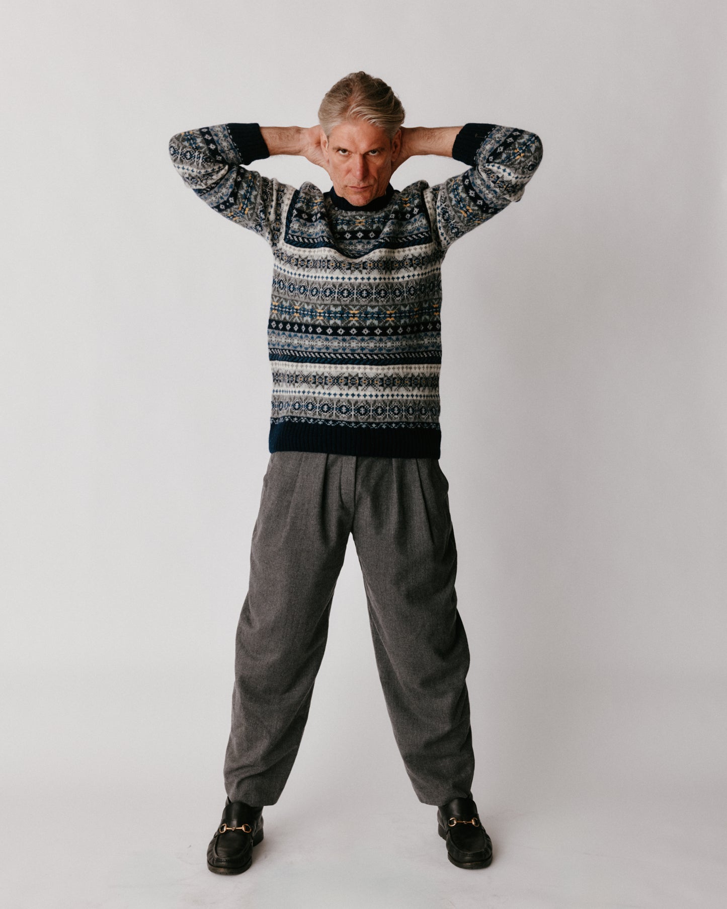 A model wearing a Bosie Blue Mogganer Crovie Fairisle in colour Navy.