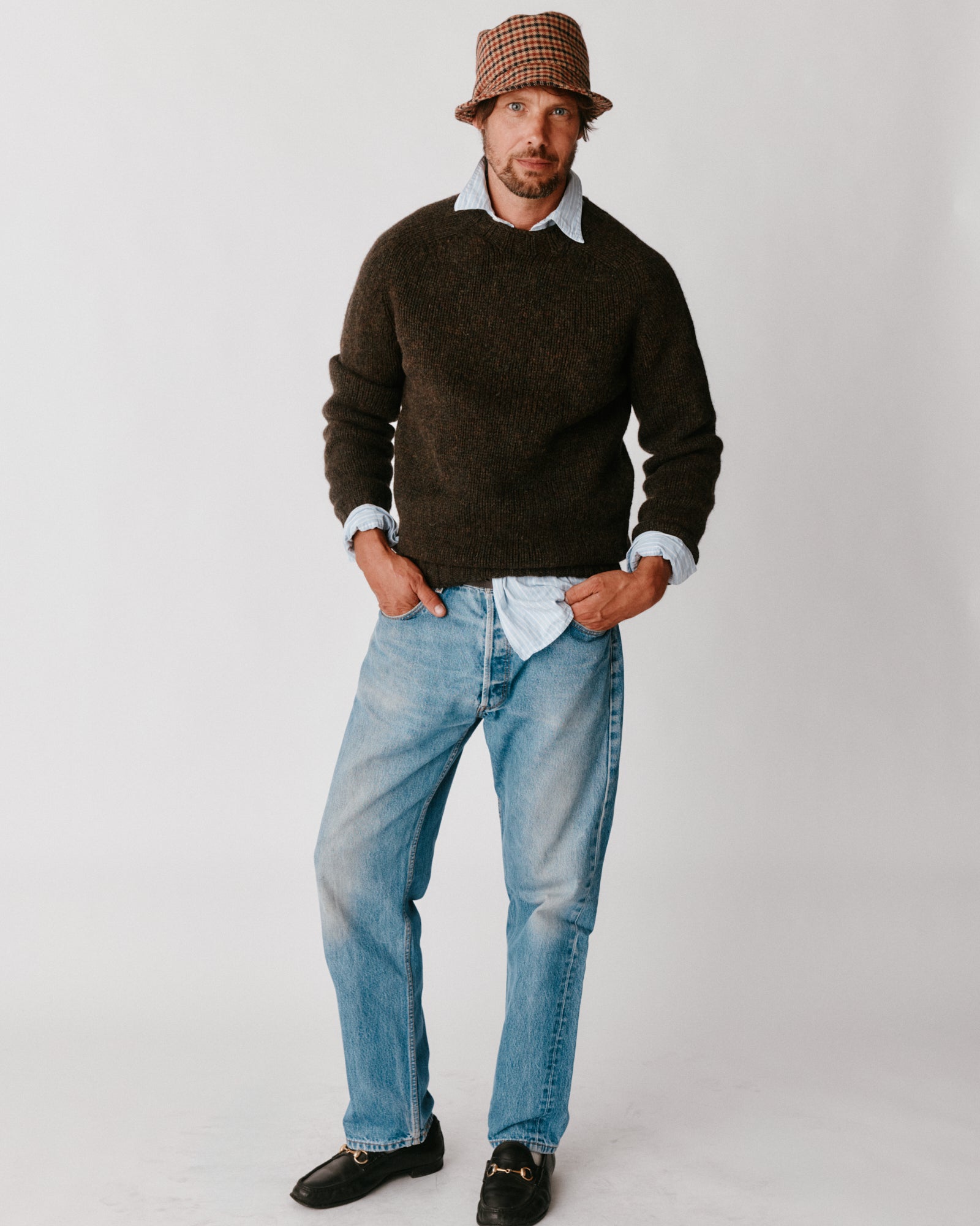 A model wearing a Bosie Blue Mogganer Explorer Extra Chunky Seamless Supersoft Shetland Sweater in colour Carob / Turin.