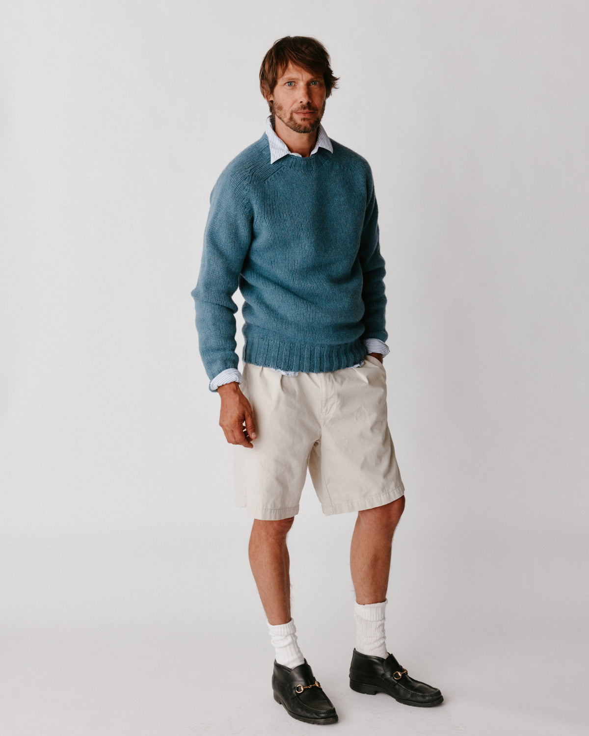 A model wearing a Bosie Blue Mogganer Explorer Extra Chunky Seamless Supersoft Shetland Sweater in colour Cirrus.