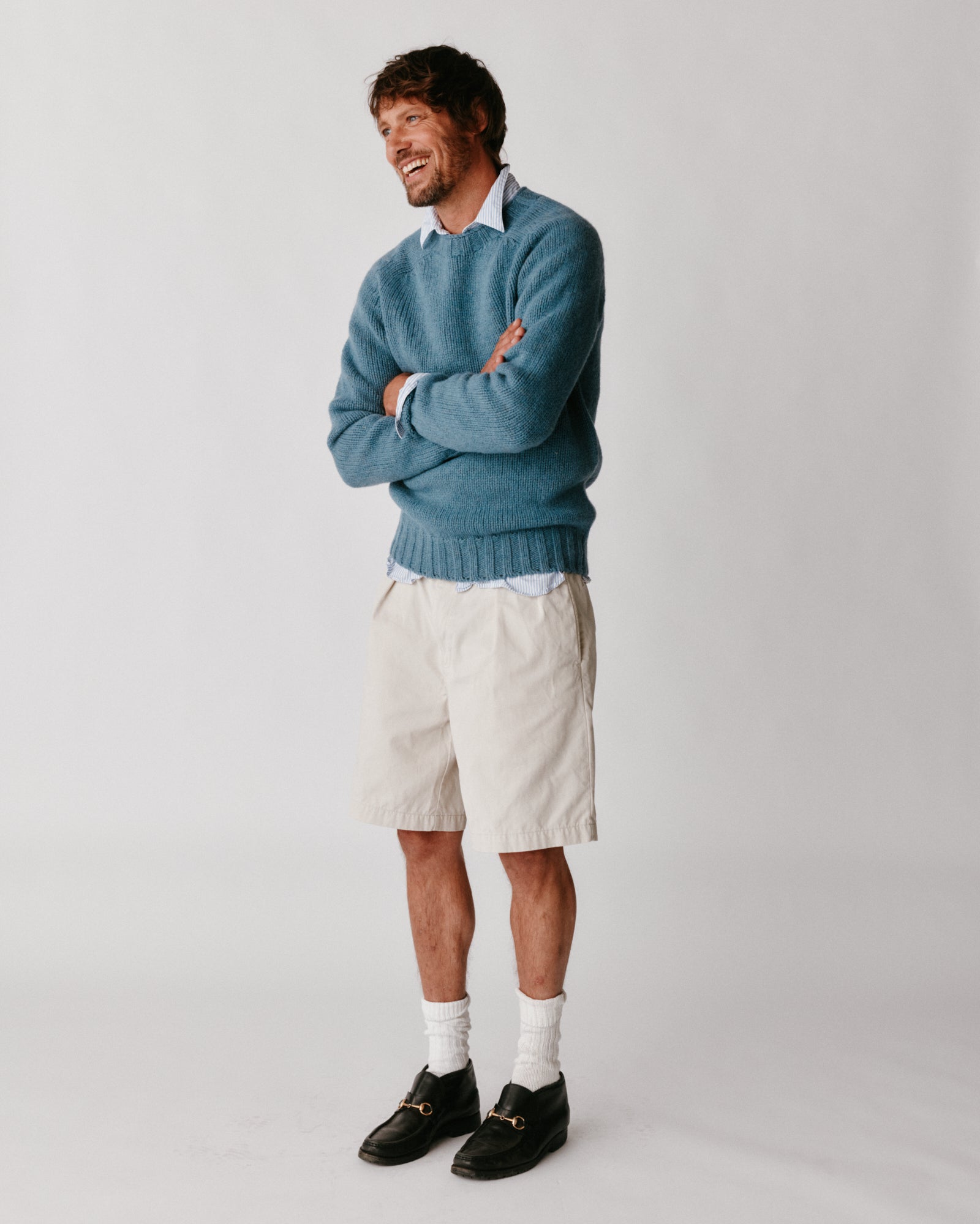 A model wearing a Bosie Blue Mogganer Explorer Extra Chunky Seamless Supersoft Shetland Sweater in colour Cirrus.