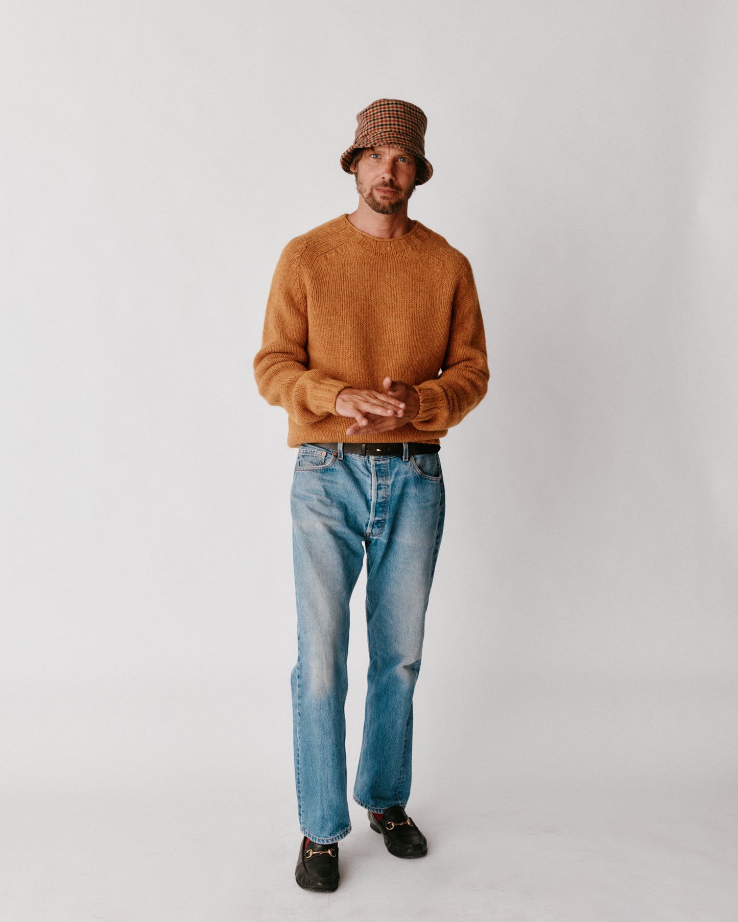 A model wearing a Bosie Blue Mogganer Explorer Extra Chunky Seamless Supersoft Shetland Sweater in colour Gold Dust / Cummin.