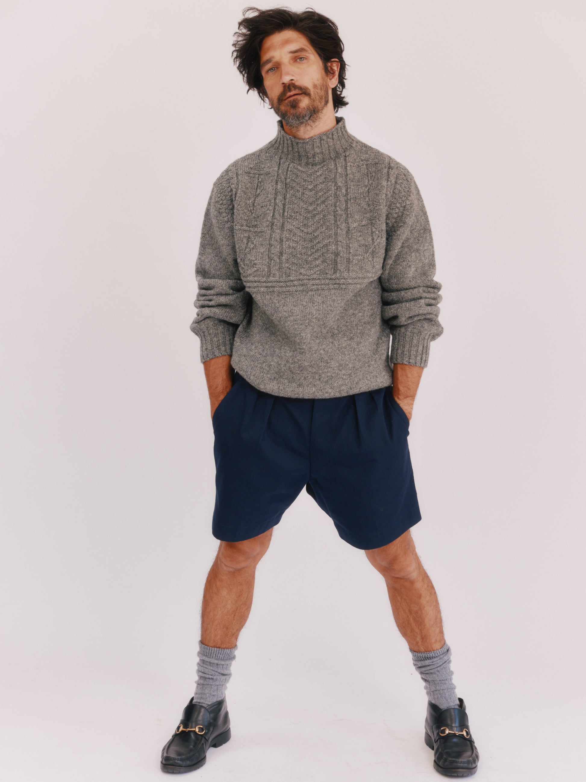Model wearing a Bosie Knitwear Blue Mogganer Ganjey Heritage Heather Knoll Crew Neck Sweater in colour Med Grey.