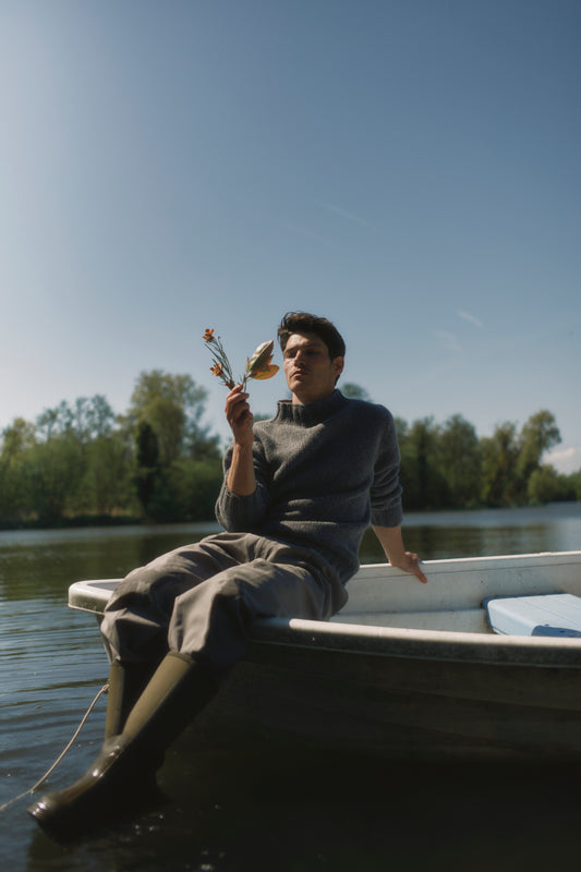 Model wearing a Bosie Knitwear Blue Mogganer Glenugie Nep Funnel Neck Lighthouse Sweater  in colour St Kilda Grey.