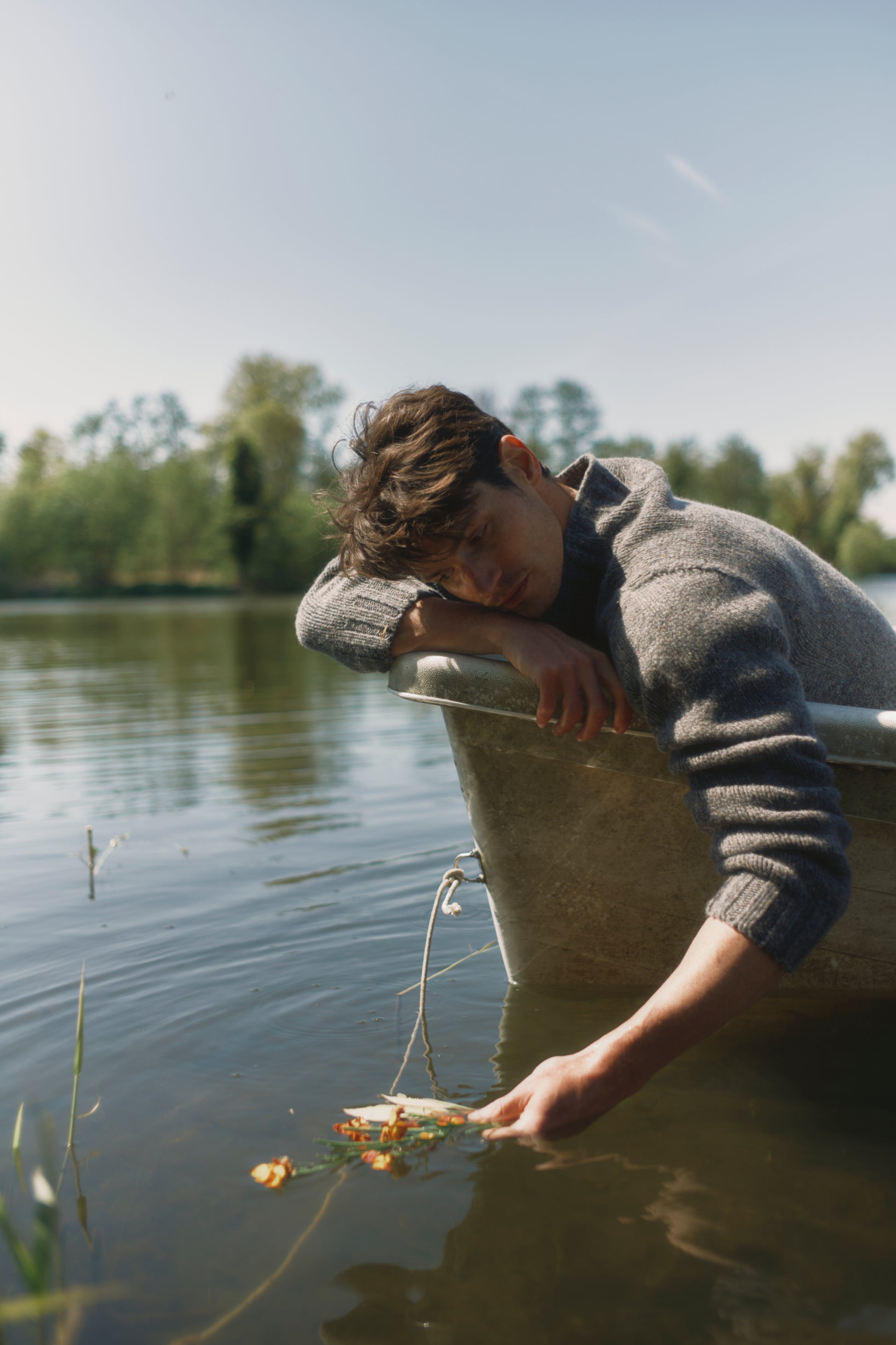 Model wearing a Bosie Knitwear Blue Mogganer Glenugie Nep Funnel Neck Lighthouse Sweater  in colour St Kilda Grey.