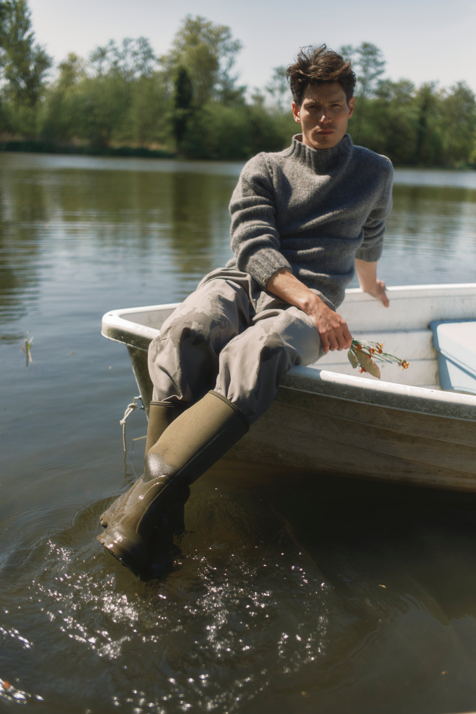 Model wearing a Bosie Knitwear Blue Mogganer Glenugie Nep Funnel Neck Lighthouse Sweater  in colour St Kilda Grey.