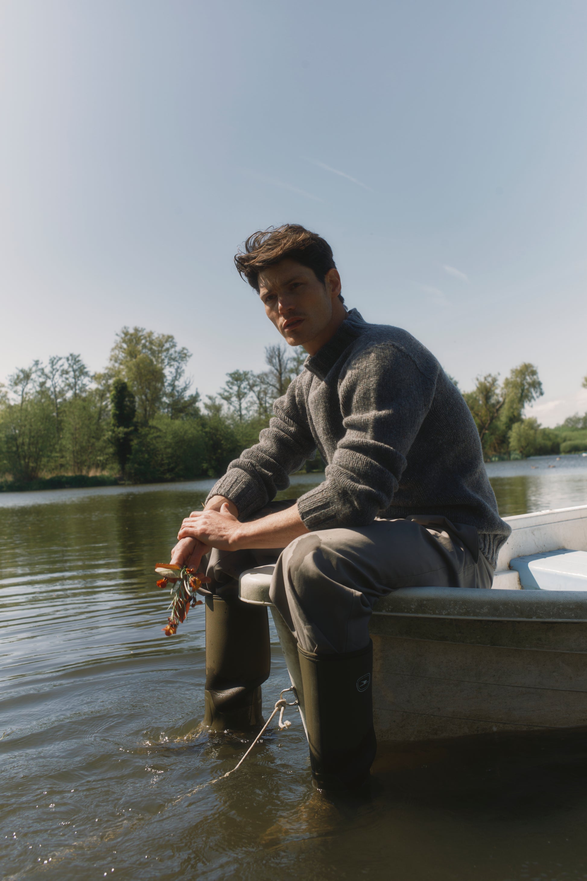 Model wearing a Bosie Knitwear Blue Mogganer Glenugie Nep Funnel Neck Lighthouse Sweater  in colour St Kilda Grey.