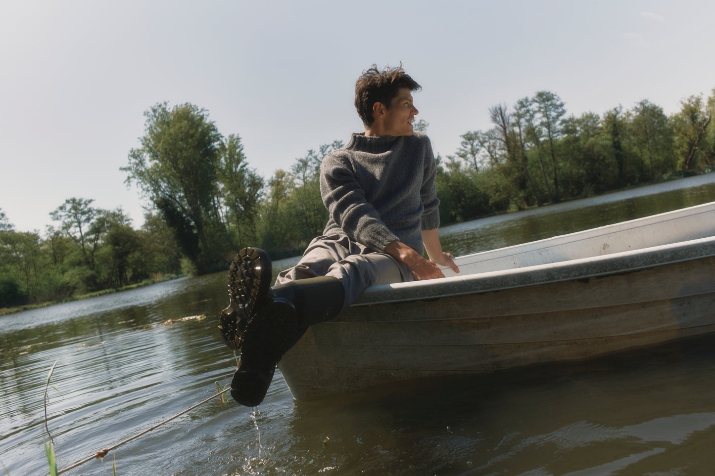 Model wearing a Bosie Knitwear Blue Mogganer Glenugie Nep Funnel Neck Lighthouse Sweater  in colour St Kilda Grey.