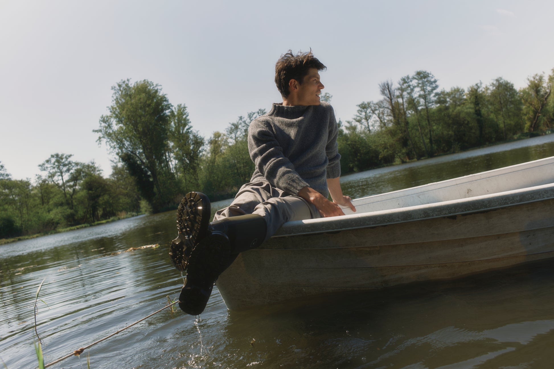 Model wearing a Bosie Knitwear Blue Mogganer Glenugie Nep Funnel Neck Lighthouse Sweater  in colour St Kilda Grey.