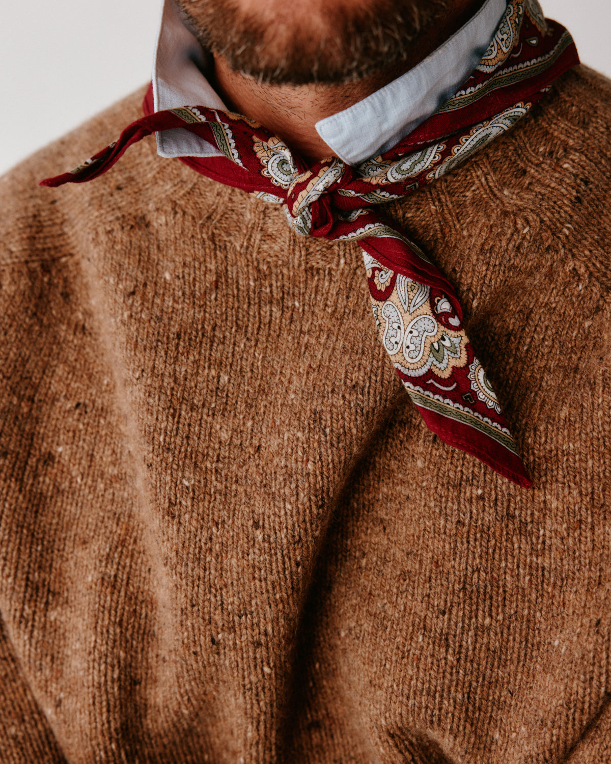 A model wearing a Bosie Blue Mogganer Helmsman Glenugie Nep Sweater in colour Knoydart Brown.