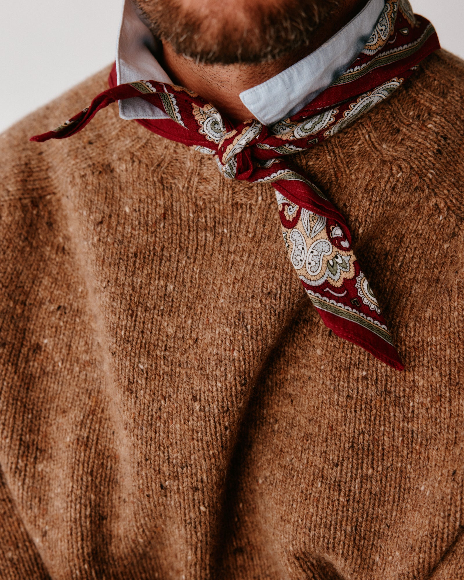 A model wearing a Bosie Blue Mogganer Helmsman Glenugie Nep Sweater in colour Knoydart Brown.