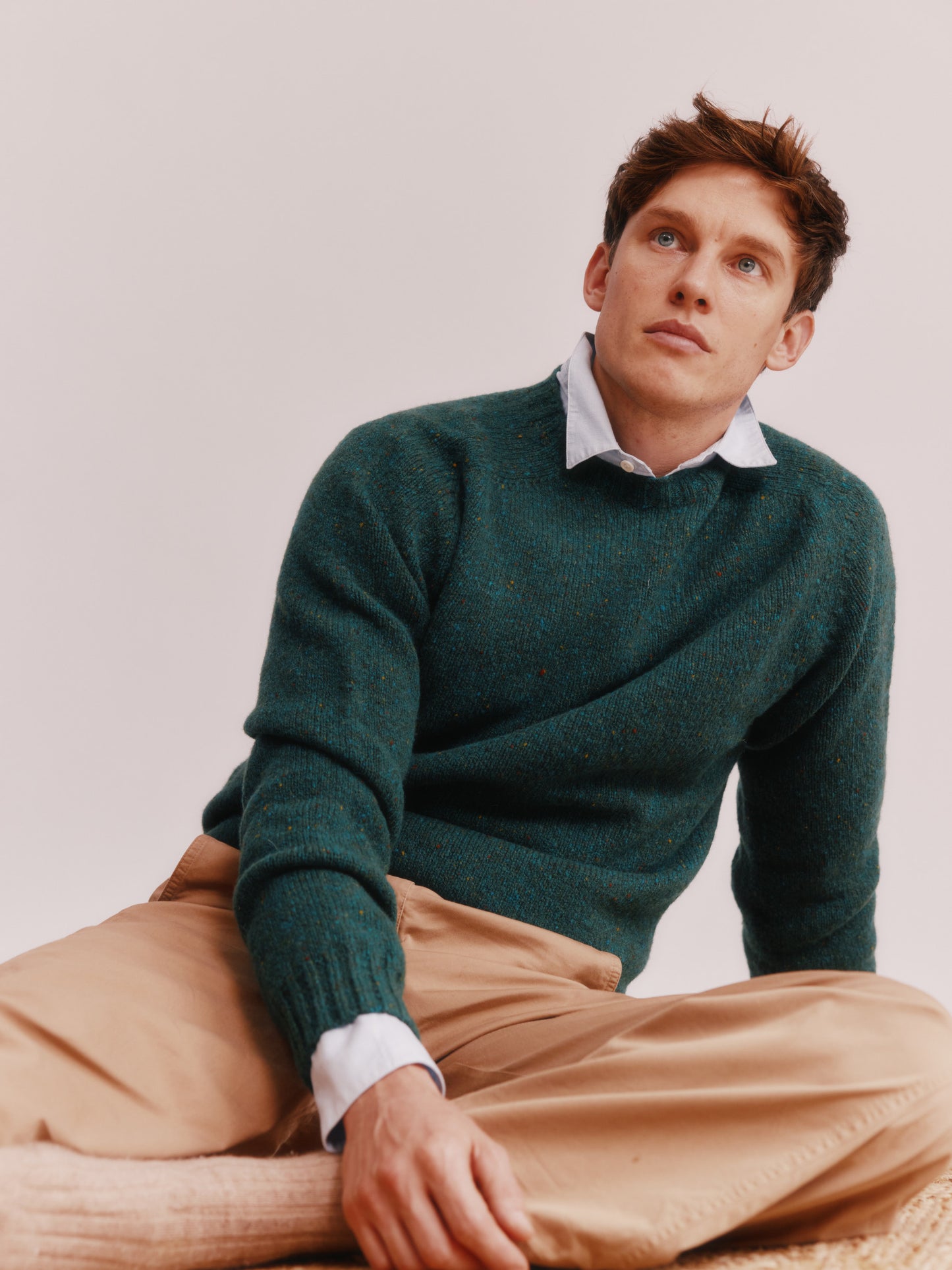 Model wearing a Bosie Knitwear Blue Mogganer Helmsman Glenugie Nep Sweater in colour Canna Green.