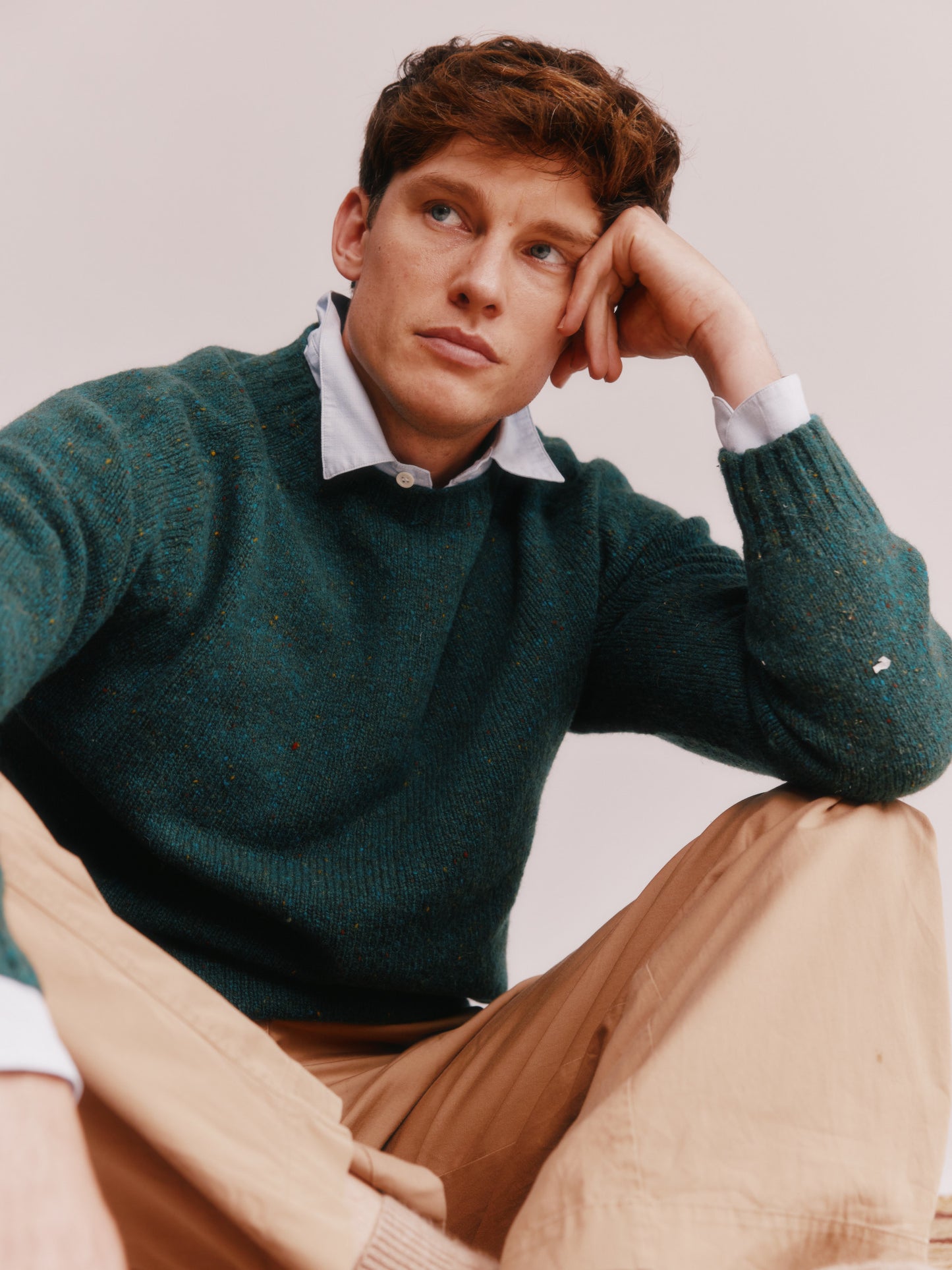 Model wearing a Bosie Knitwear Blue Mogganer Helmsman Glenugie Nep Sweater in colour Canna Green.
