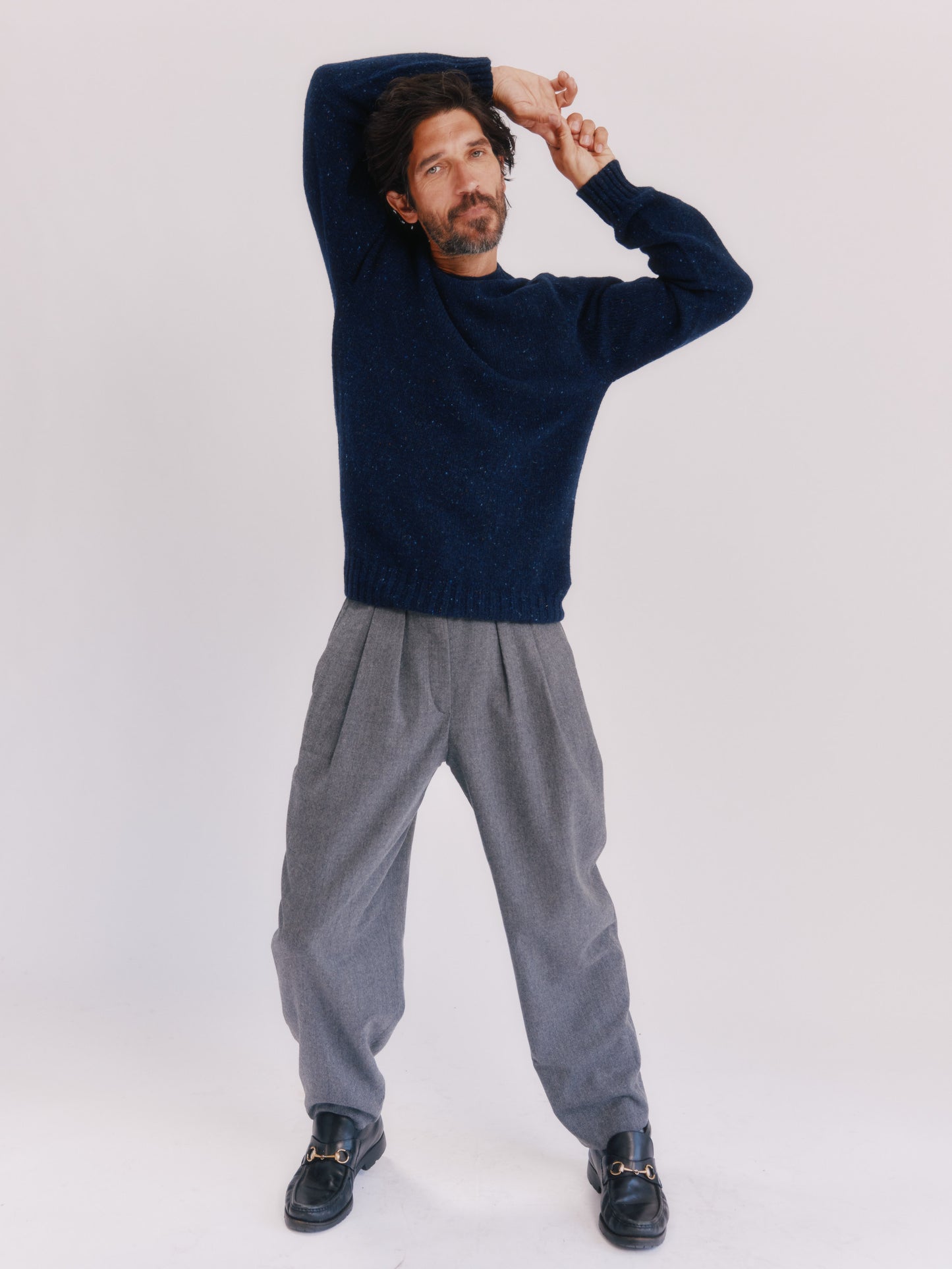 Model wearing a Bosie Knitwear Blue Mogganer Helmsman Glenugie Nep Sweater in colour Jura Navy.
