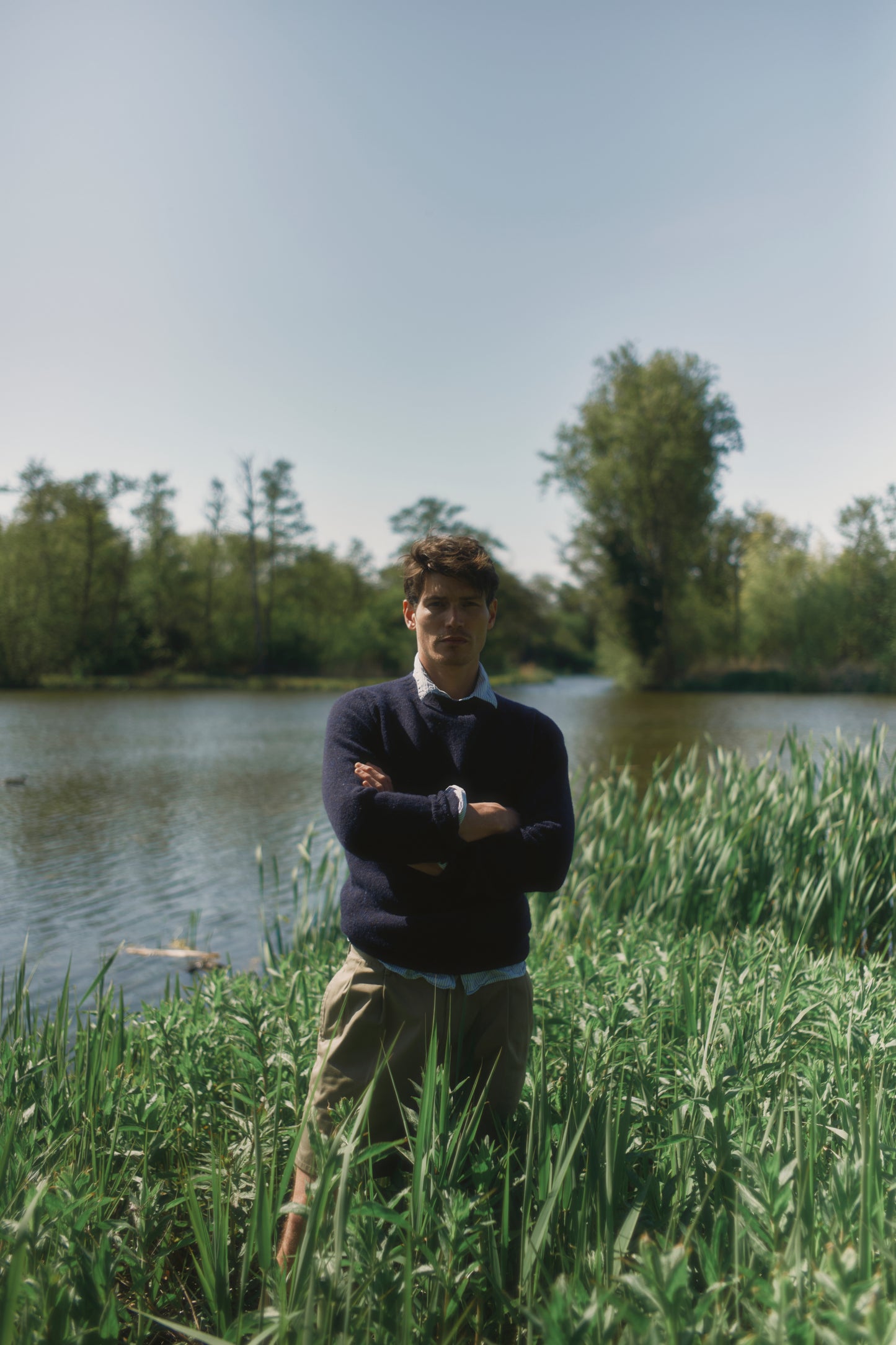Model wearing a Bosie Knitwear Blue Mogganer Helmsman Glenugie Nep Sweater in colour Jura Navy.