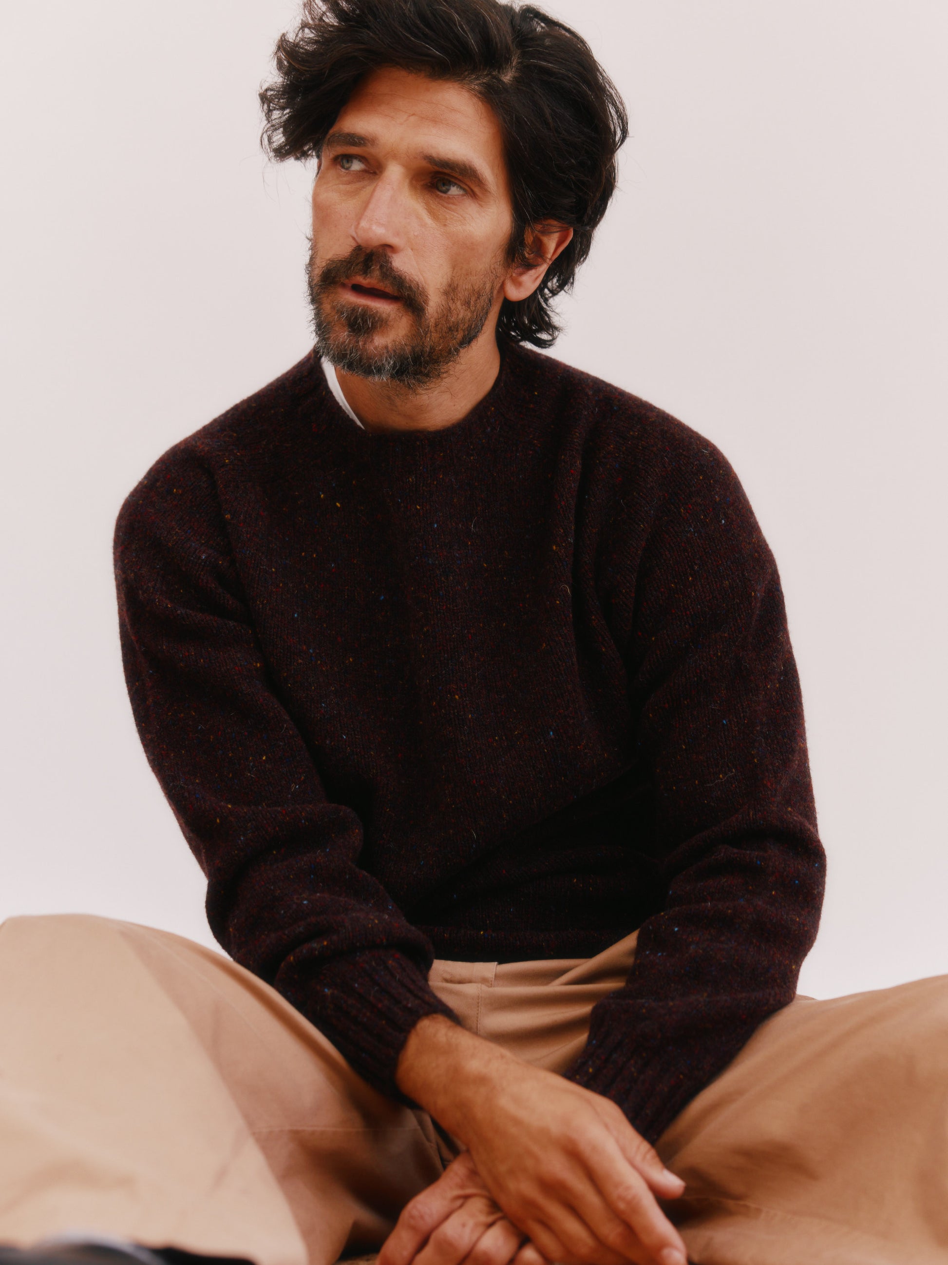 Model wearing a Bosie Knitwear Blue Mogganer Helmsman Glenugie Nep Sweater in colour Lewis Dark Aubergine.