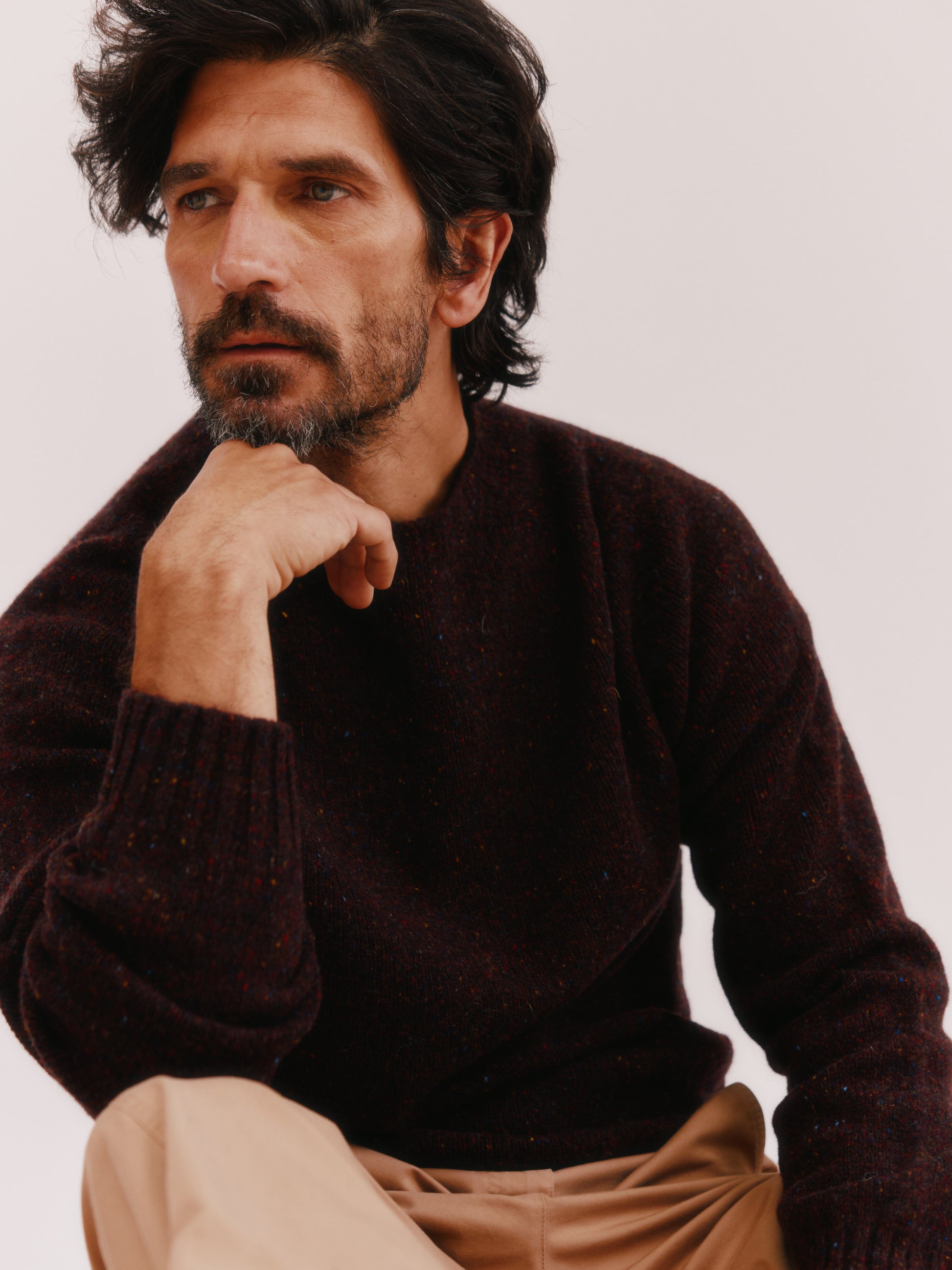 Model wearing a Bosie Knitwear Blue Mogganer Helmsman Glenugie Nep Sweater in colour Lewis Dark Aubergine.