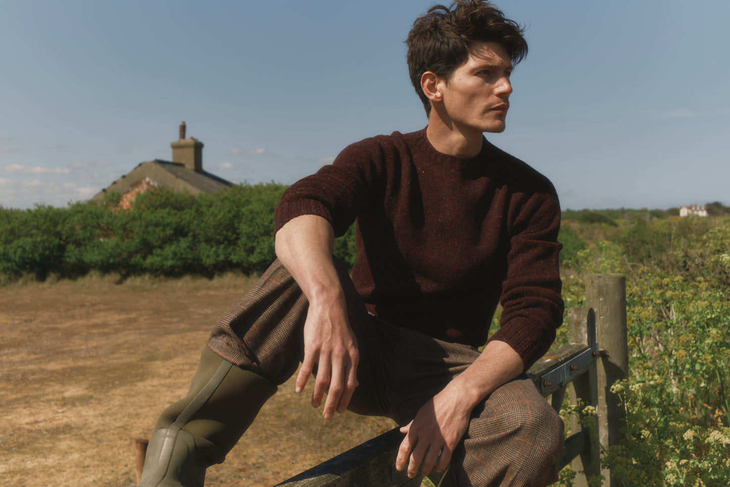 Model wearing a Bosie Knitwear Blue Mogganer Helmsman Glenugie Nep Sweater in colour Lewis Dark Aubergine.