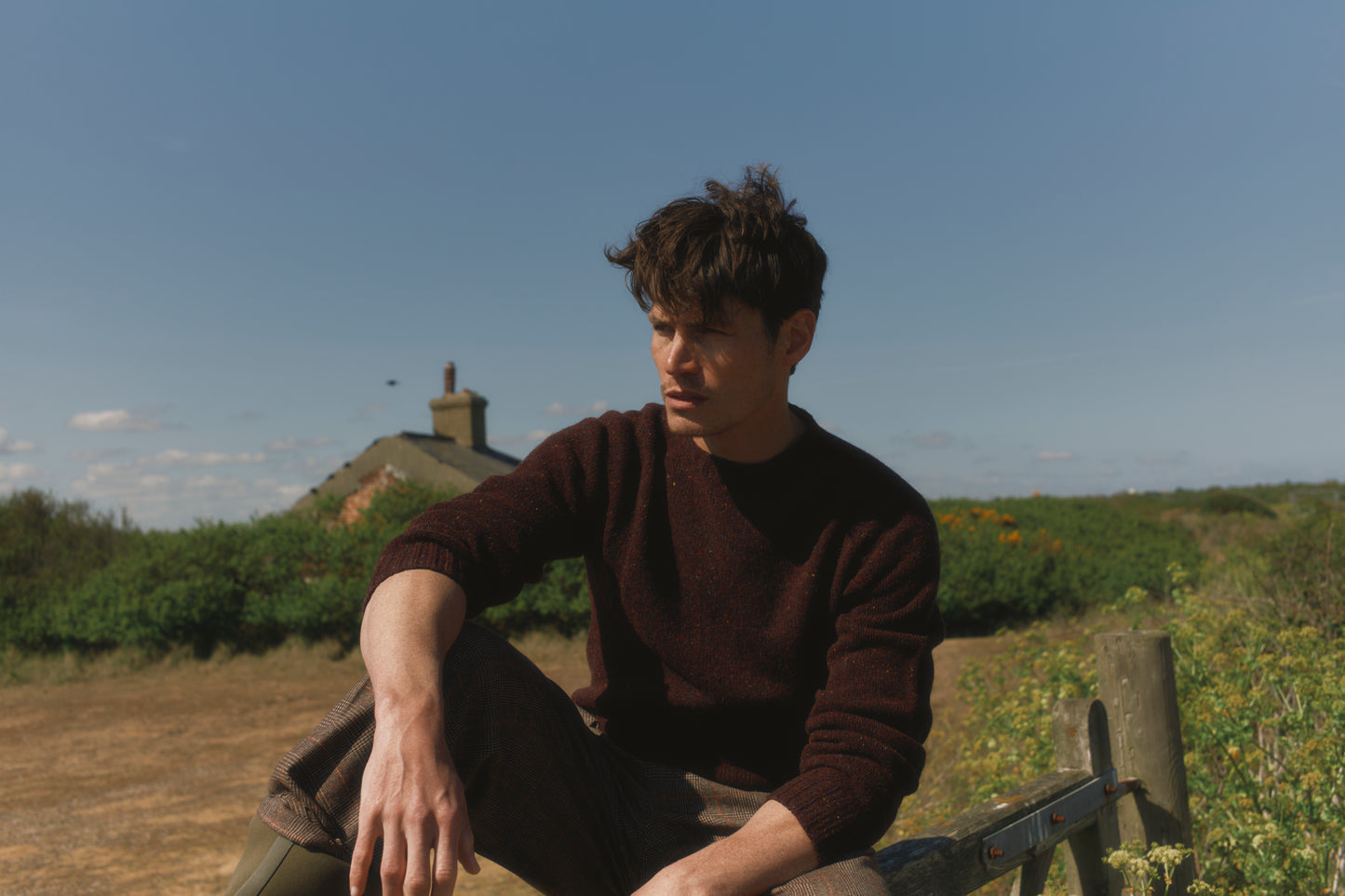 Model wearing a Bosie Knitwear Blue Mogganer Helmsman Glenugie Nep Sweater in colour Lewis Dark Aubergine.
