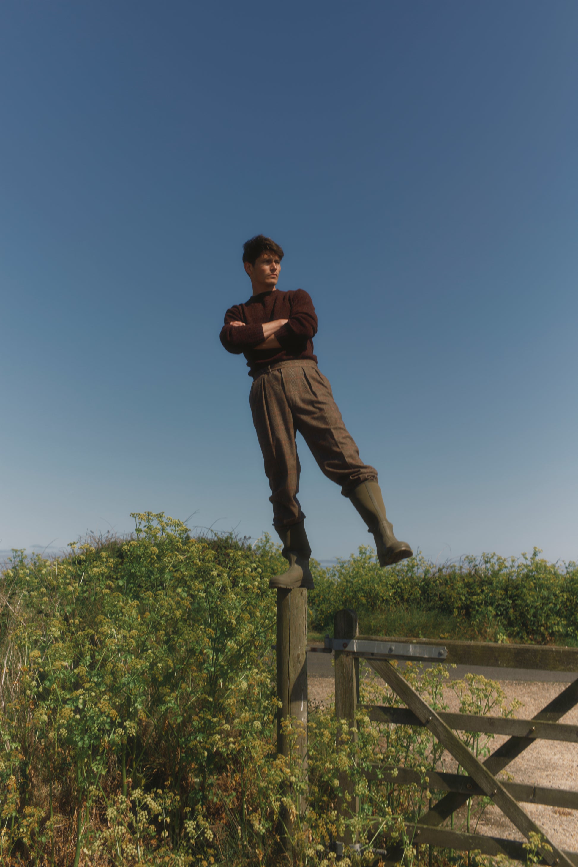 Model wearing a Bosie Knitwear Blue Mogganer Helmsman Glenugie Nep Sweater in colour Lewis Dark Aubergine.