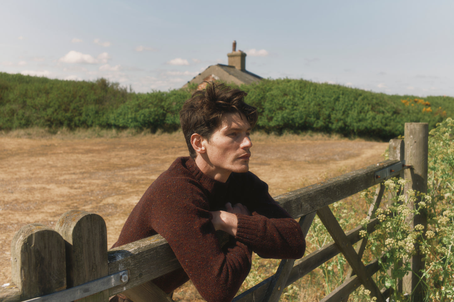 Model wearing a Bosie Knitwear Blue Mogganer Helmsman Glenugie Nep Sweater in colour Lewis Dark Aubergine.