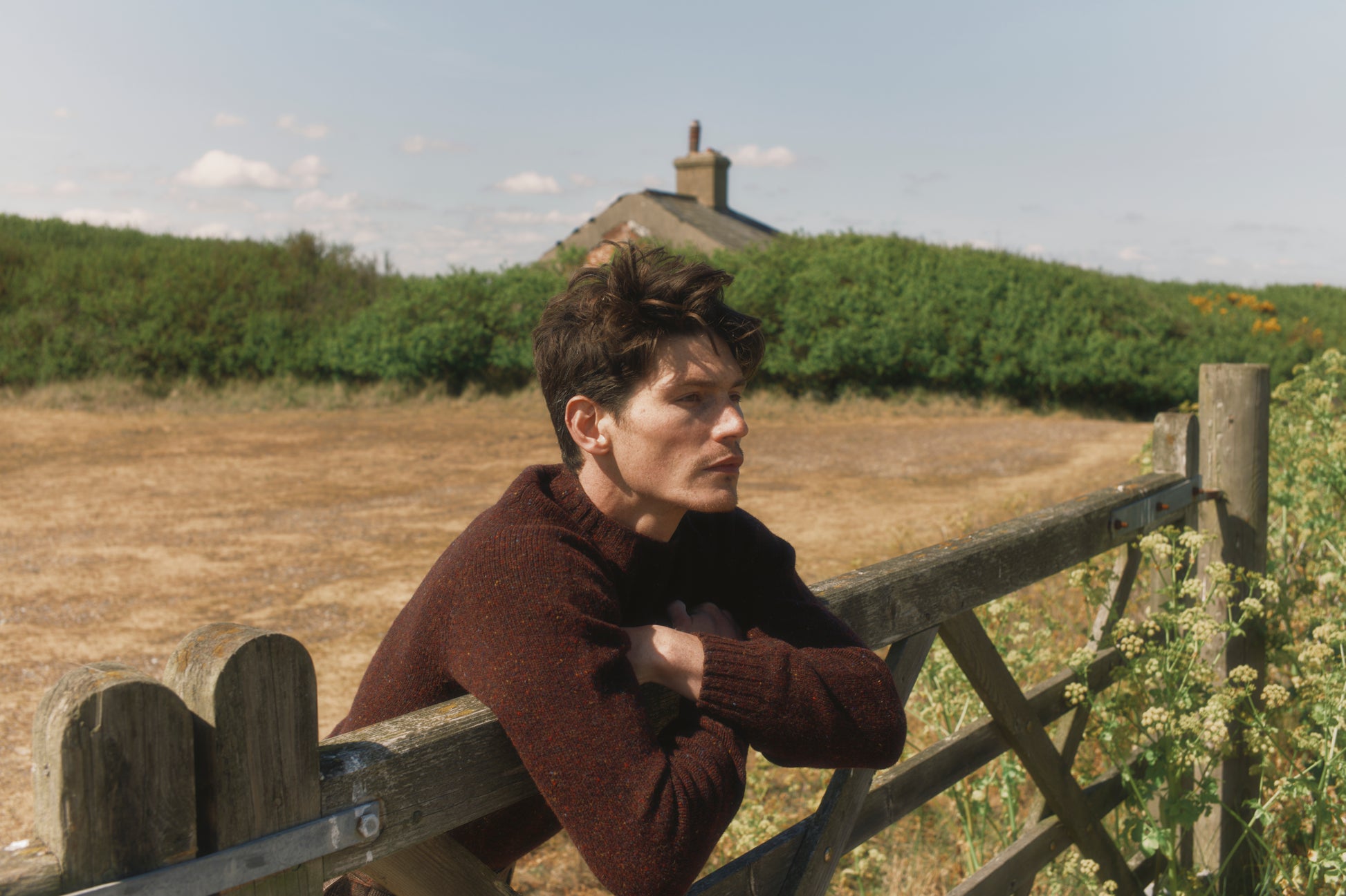 Model wearing a Bosie Knitwear Blue Mogganer Helmsman Glenugie Nep Sweater in colour Lewis Dark Aubergine.