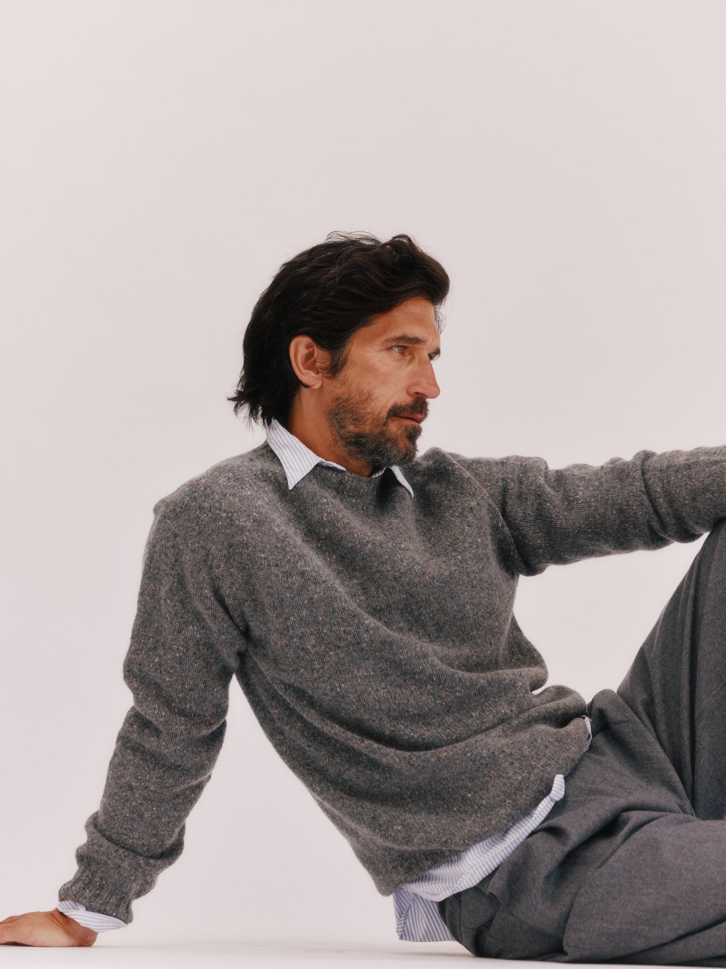 Model wearing a Bosie Knitwear Blue Mogganer Helmsman Glenugie Nep Sweater in colour St Kilda Grey.