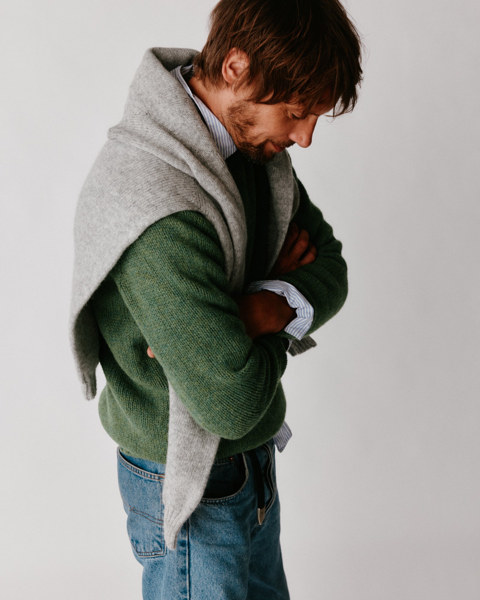 A model wearing a Bosie Blue Mogganer North Sea Chunky Seamless Supersoft Shetland Sweater in colour Baize.
