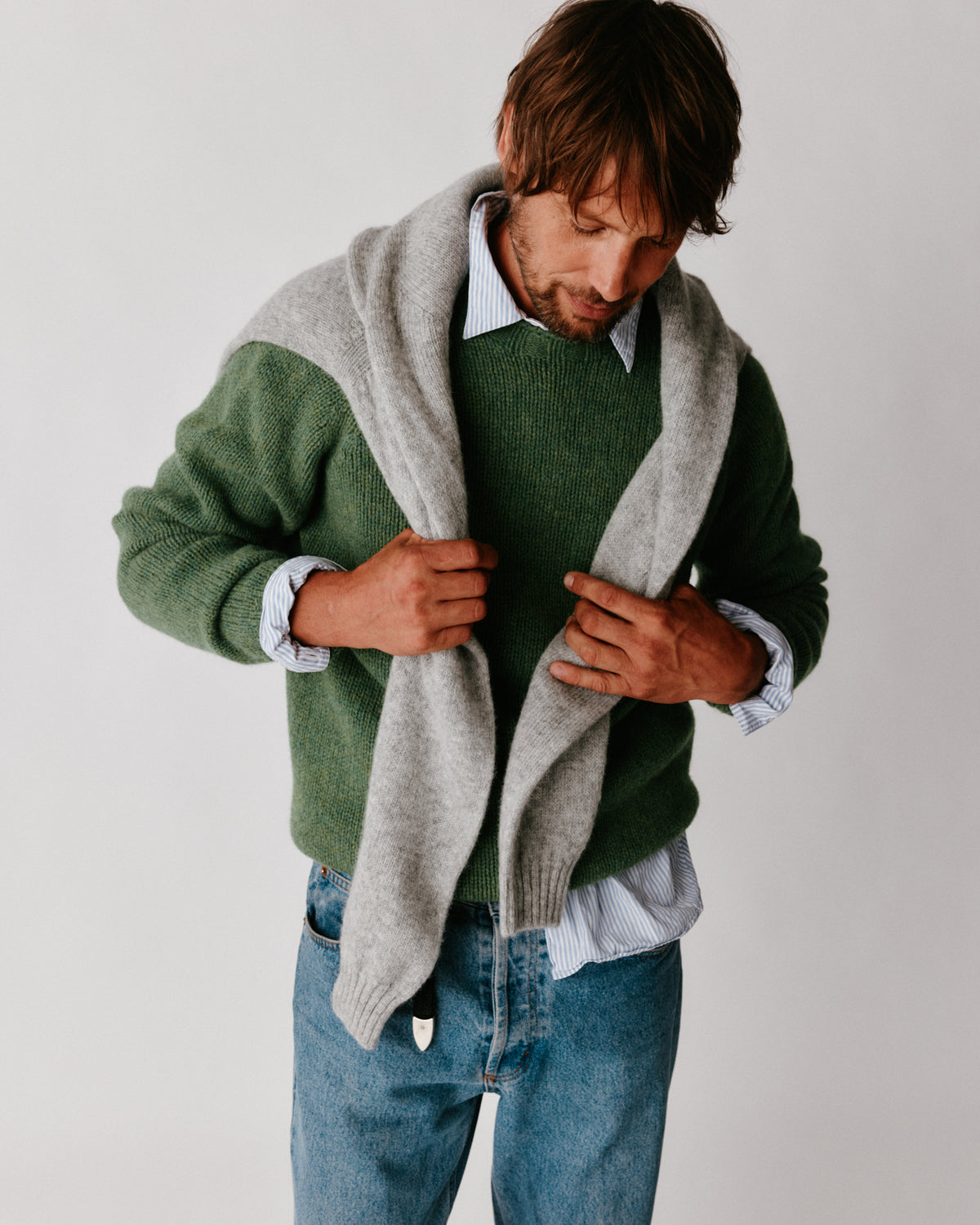 A model wearing a Bosie Blue Mogganer North Sea Chunky Seamless Supersoft Shetland Sweater in colour Baize.