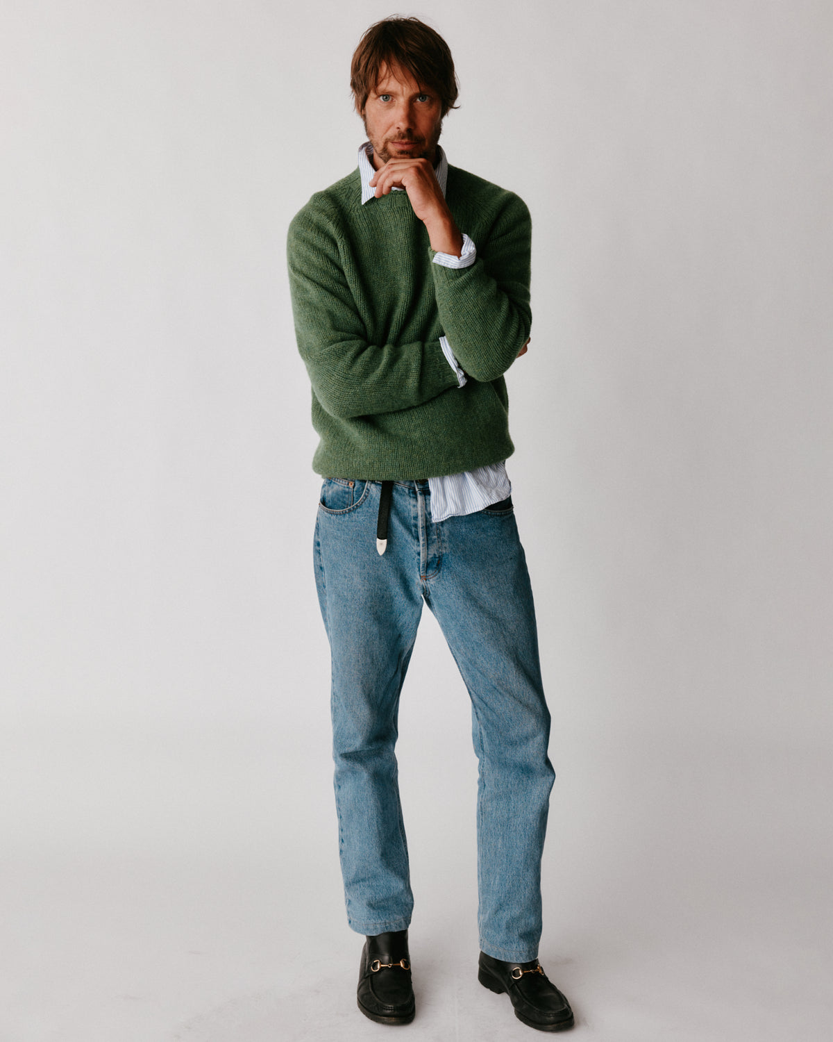 A model wearing a Bosie Blue Mogganer North Sea Chunky Seamless Supersoft Shetland Sweater in colour Baize.