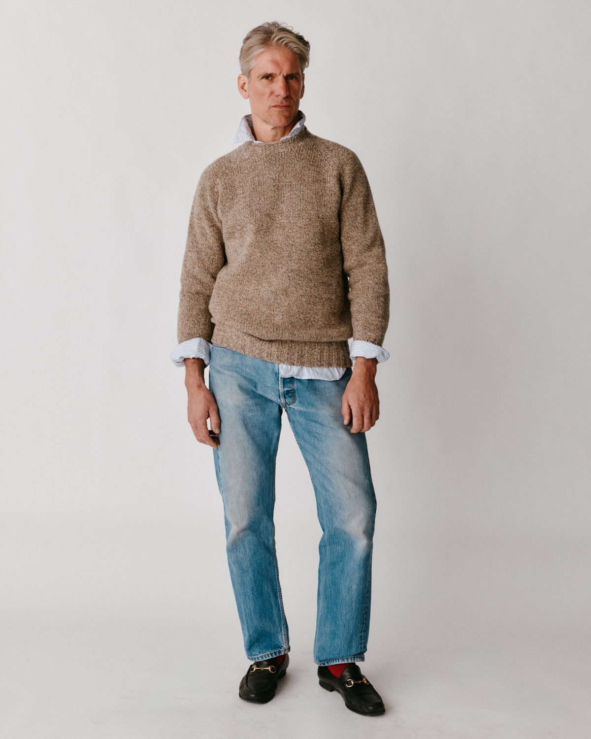 A model wearing a Bosie Blue Mogganer North Sea Chunky Seamless Supersoft Shetland Sweater in colour  Pebble / Mushroom.