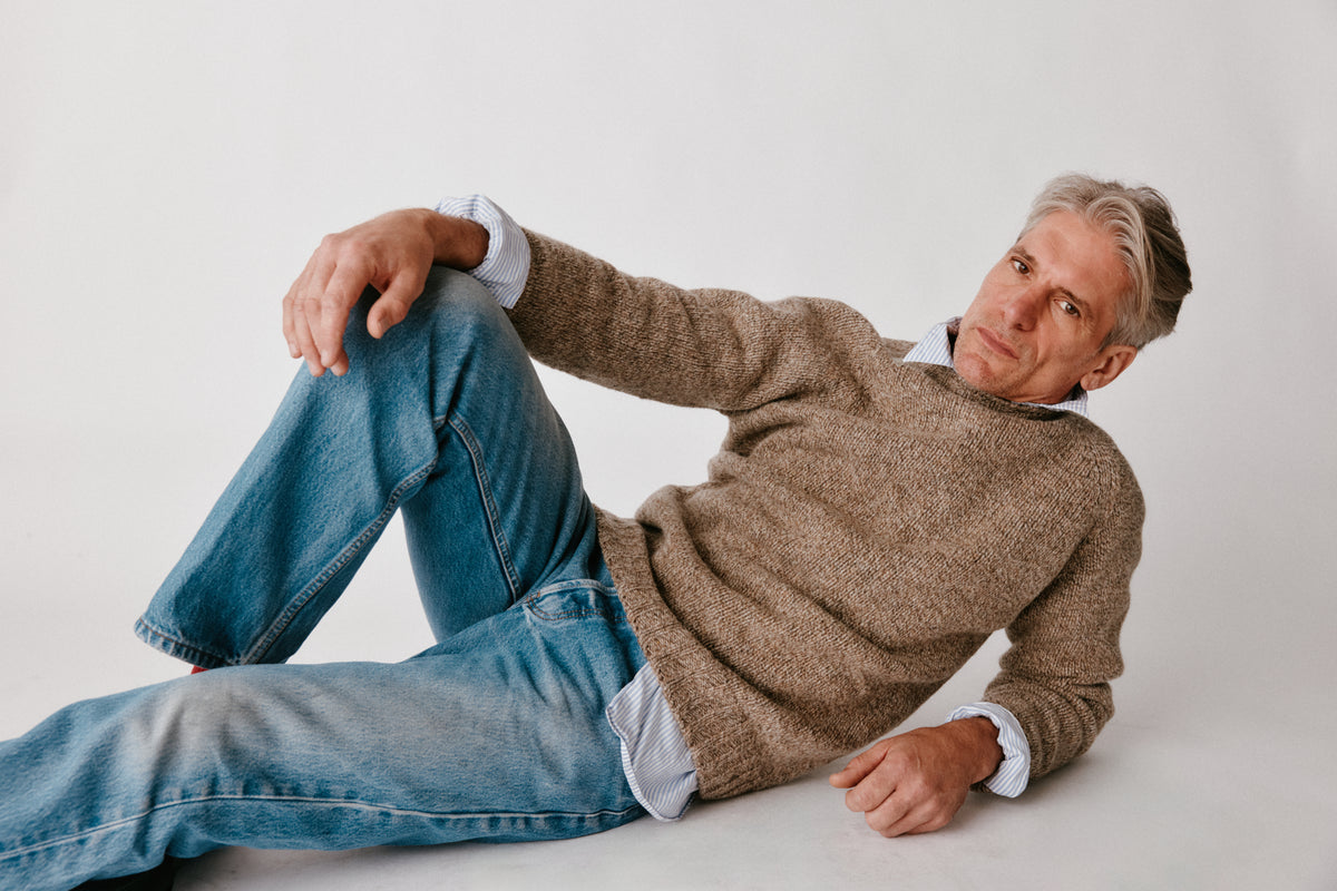 A model wearing a Bosie Blue Mogganer North Sea Chunky Seamless Supersoft Shetland Sweater in colour Pebble / Mushroom.