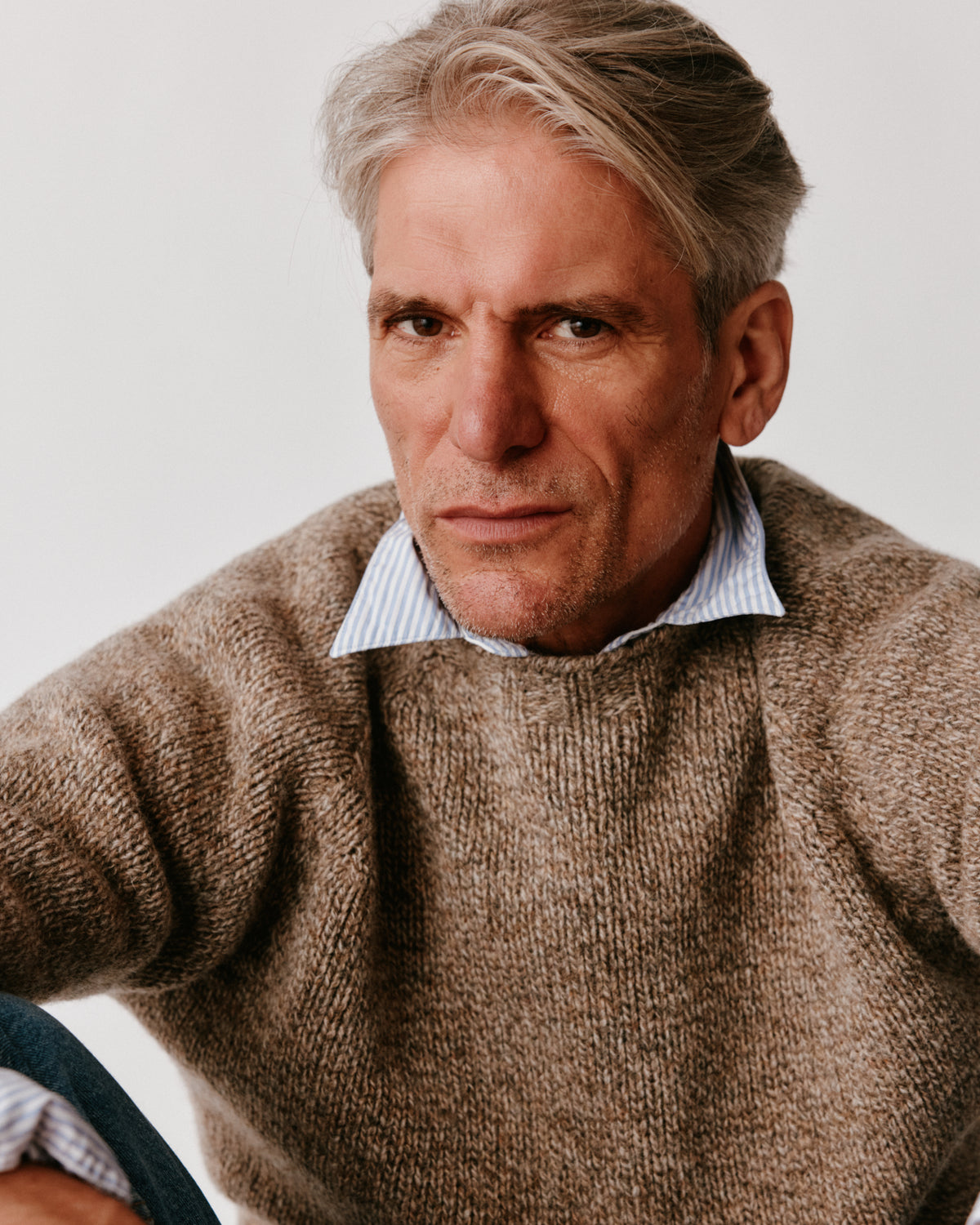 A model wearing a Bosie Blue Mogganer North Sea Chunky Seamless Supersoft Shetland Sweater in colour Pebble / Mushroom.