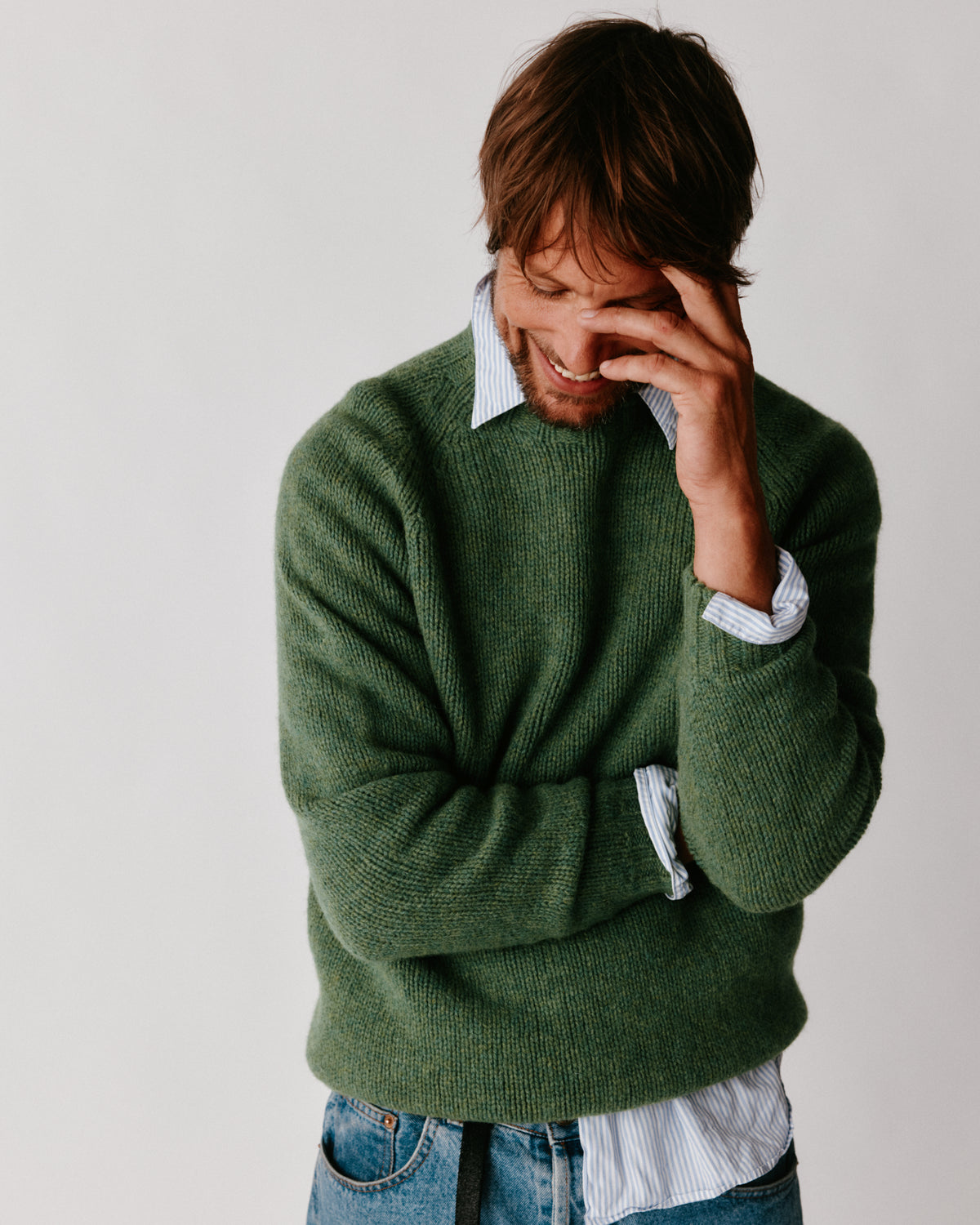 A model wearing a Bosie Blue Mogganer North Sea Chunky Seamless Supersoft Shetland Sweater in colour Baize.