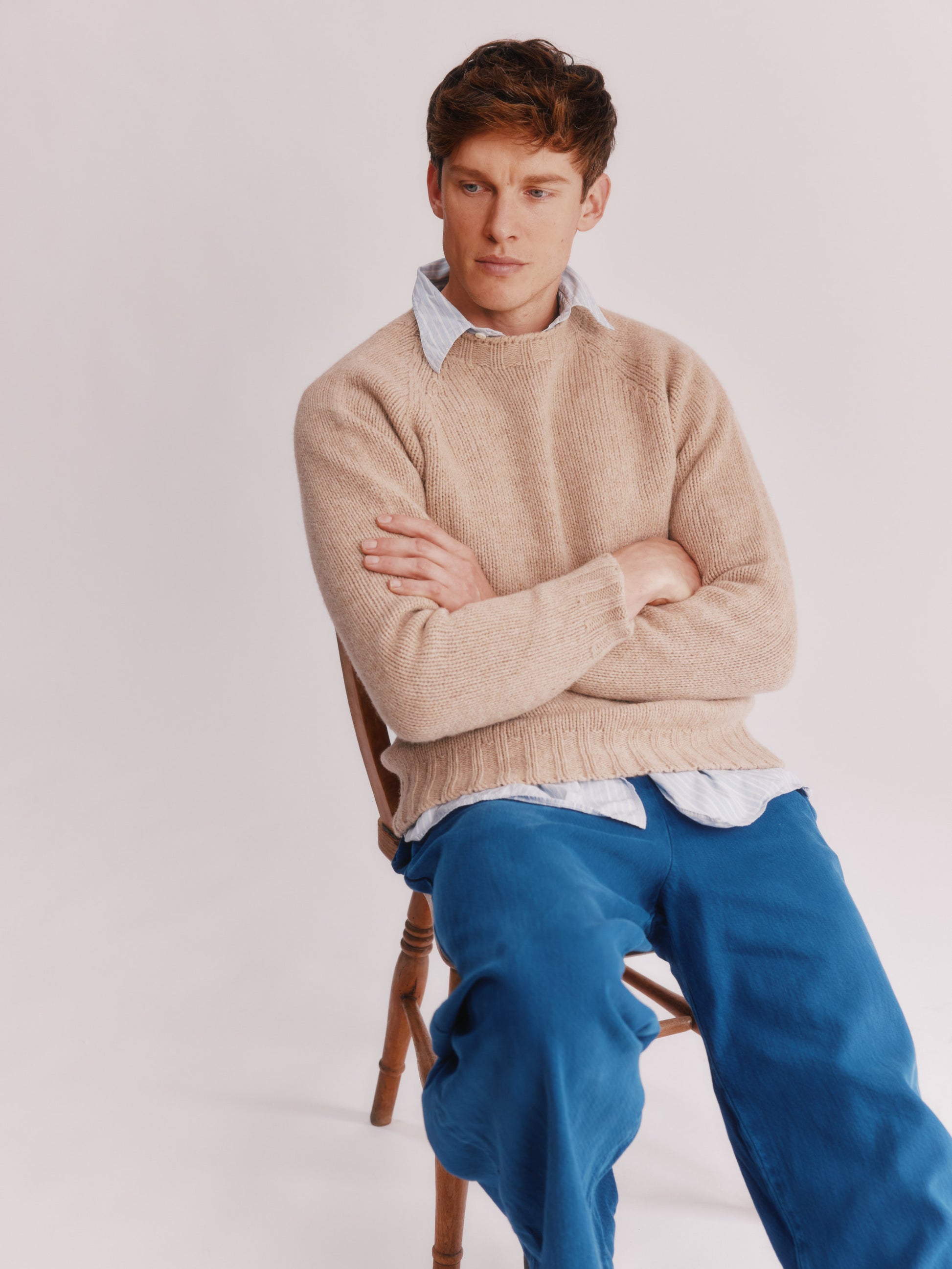 Model wearing a Bosie Knitwear Blue Mogganer North Sea Chunky Seamless Supersoft Shetland Sweater in colour Oatmilk Beige.