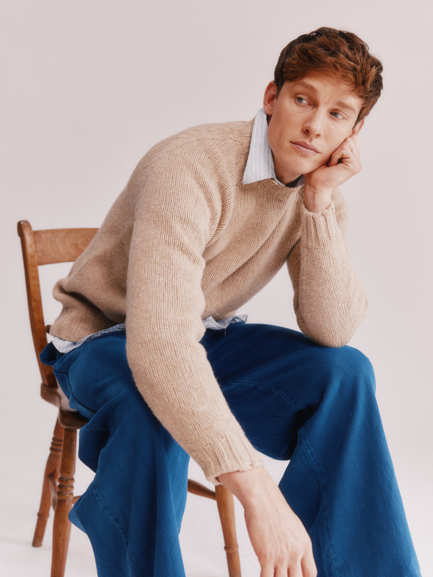 Model wearing a Bosie Knitwear Blue Mogganer North Sea Chunky Seamless Supersoft Shetland Sweater in colour Oatmilk Beige.