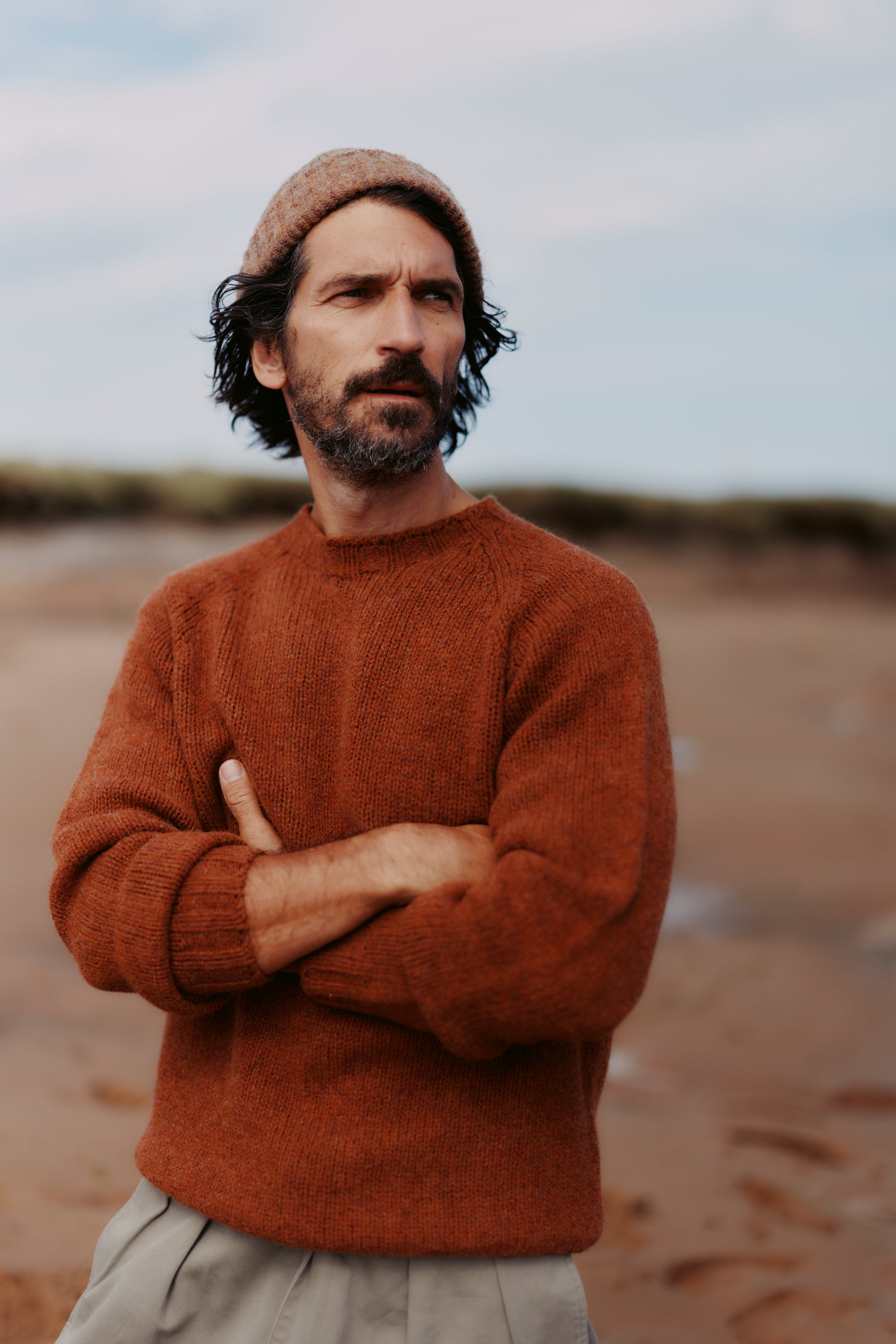 Man wearing a Bosie Knitwear Blue Mogganer North Sea Chunky Seamless Supersoft Shetland Sweater in colour Sienna Brown.