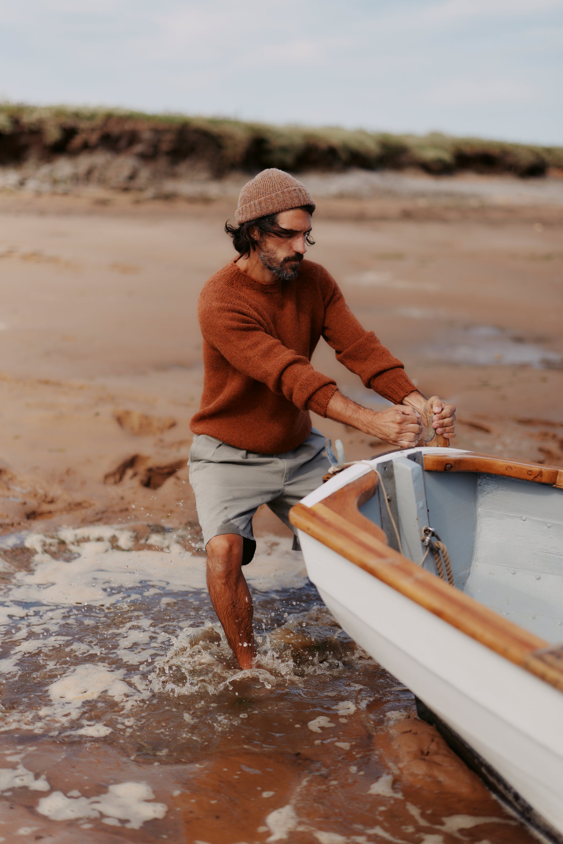 Man wearing a Bosie Knitwear Blue Mogganer North Sea Chunky Seamless Supersoft Shetland Sweater in colour Sienna Brown.