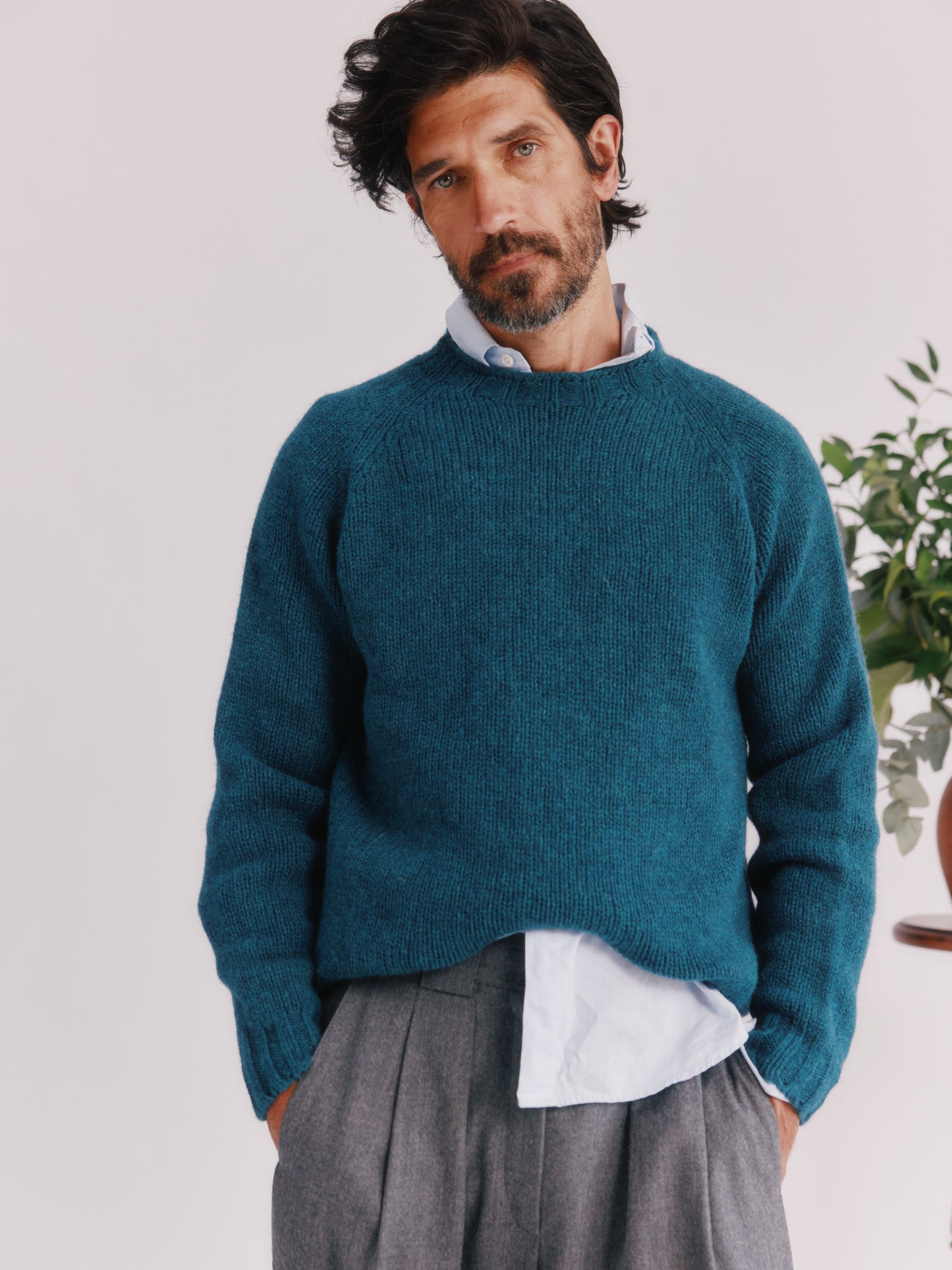 Model wearing a Bosie Knitwear Blue Mogganer North Sea Chunky Seamless Supersoft Shetland Sweater in colour Storm Dark Teal.