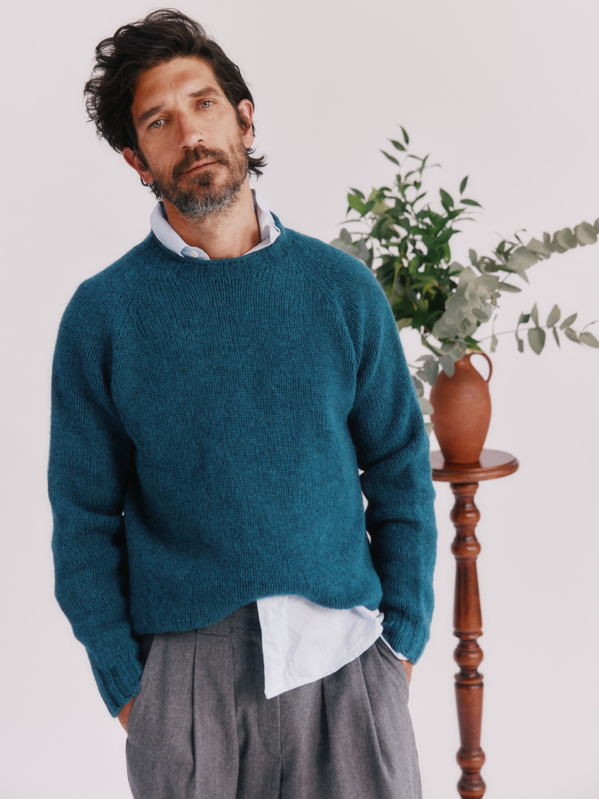 Model wearing a Bosie Knitwear Blue Mogganer North Sea Chunky Seamless Supersoft Shetland Sweater in colour Storm Dark Teal.