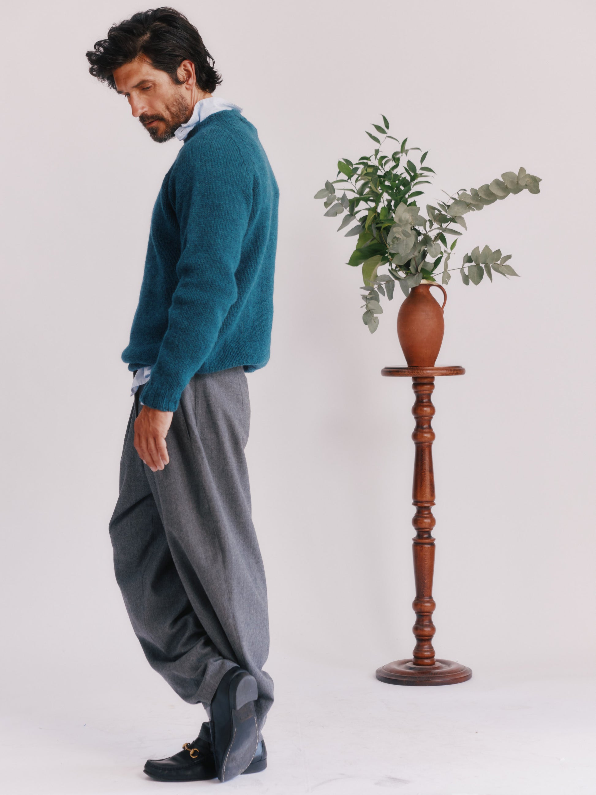 Model wearing a Bosie Knitwear Blue Mogganer North Sea Chunky Seamless Supersoft Shetland Sweater in colour Storm Dark Teal.