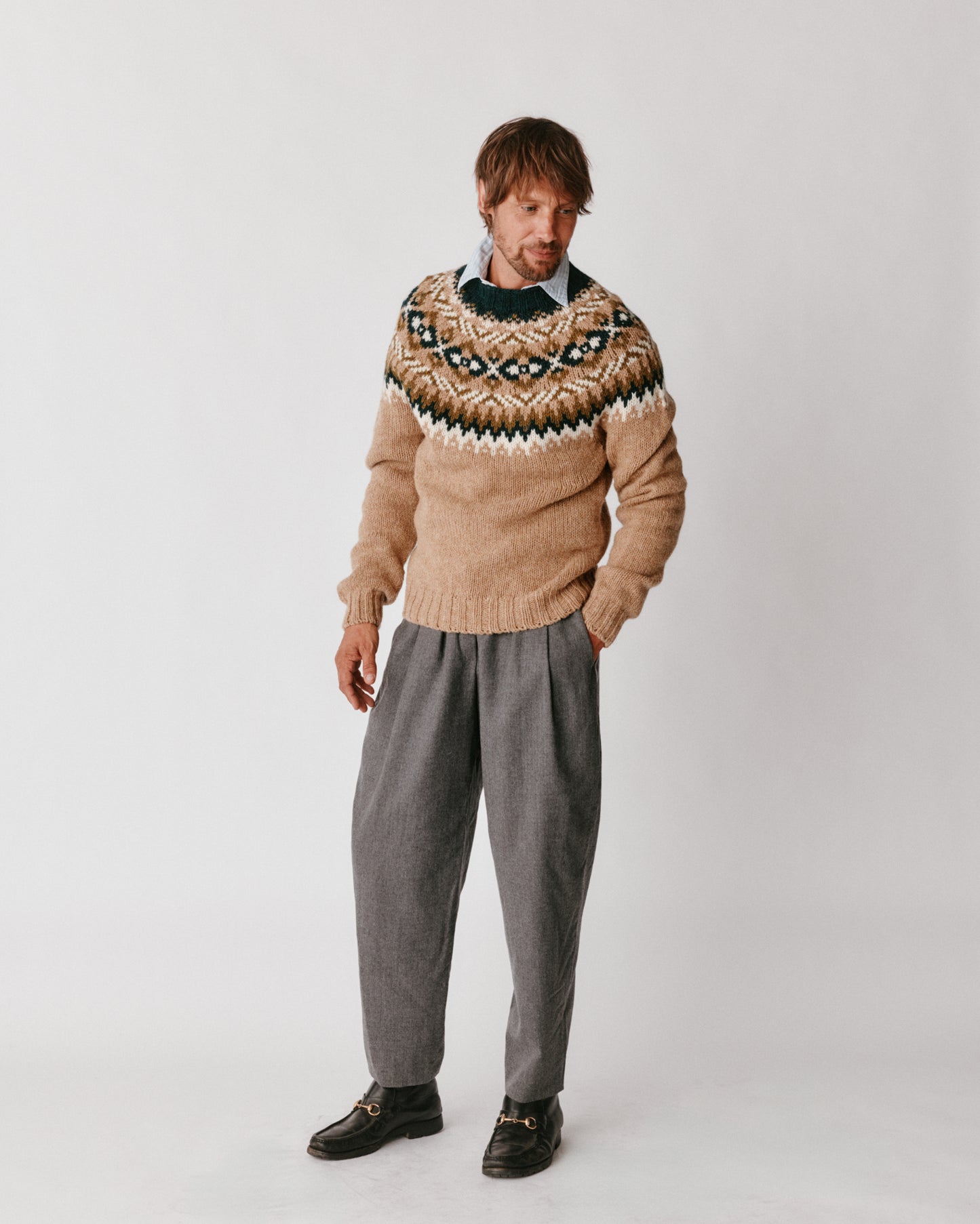 A model wearing a BOsie Blue Mogganer Northeaster Fairisle Yoke Chunky Ecology British Wool in colour Walnut Brown.