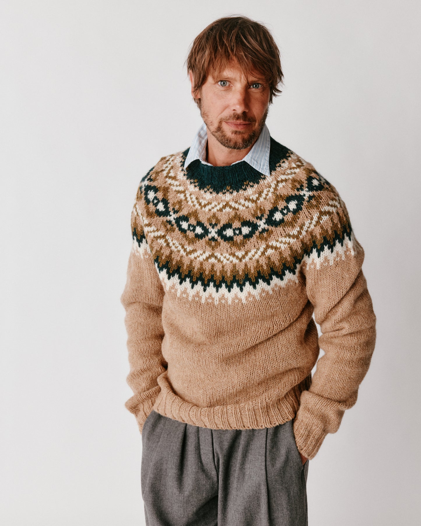 A model wearing a Bosie Blue Mogganer Northeaster Fairisle Yoke Chunky Ecology British Wool in colour Walnut Brown.