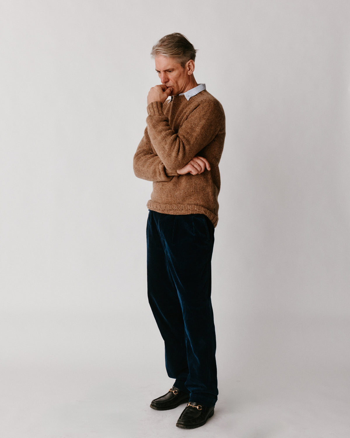 A model wearing a Bose Blue Mogganer Trawlerman Chunky Glenugie Nep Sweater in colour Knoydart.