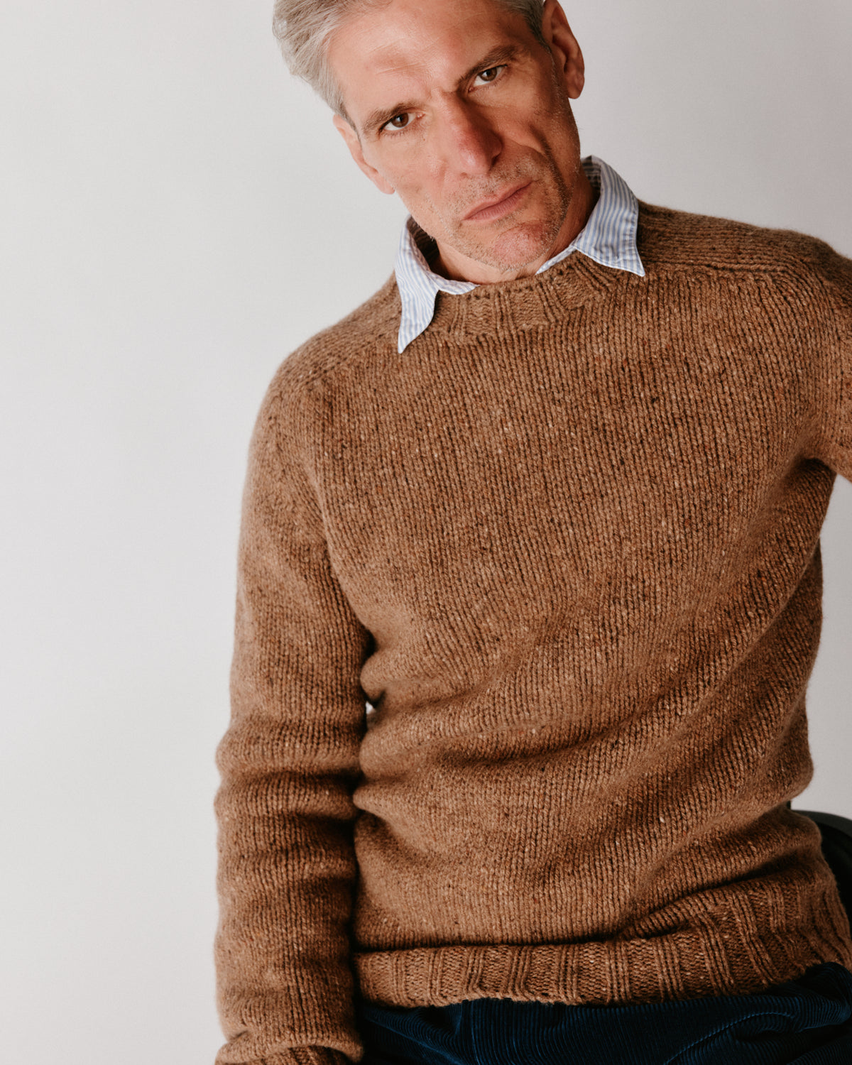 A model wearing a Bosie Blue Mogganer Trawlerman Chunky Glenugie Nep Sweater in colour Knoydart