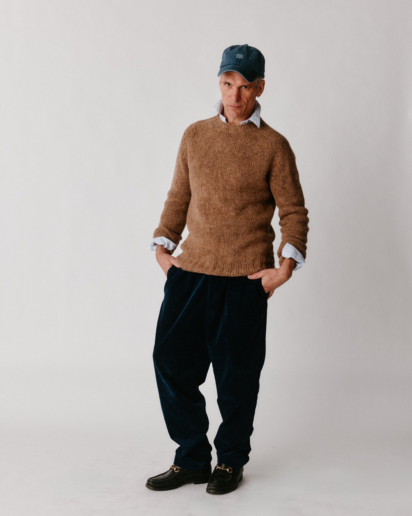 A model wearing a Bosie Blue Mogganer Trawlerman Chunky Glenugie Nep Sweater in colour Knoydart.