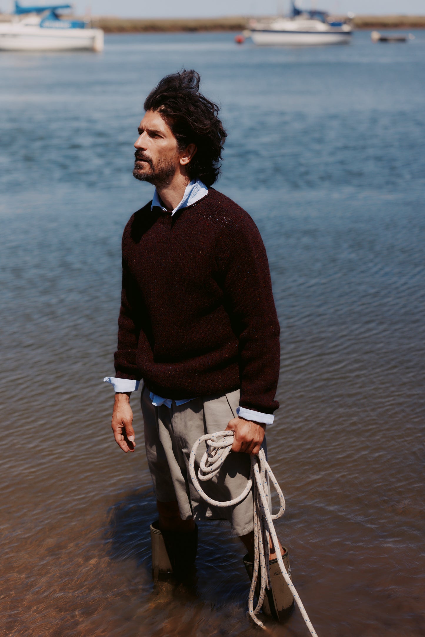 Model wearing a Bosie Knitwear Blue Mogganer Trawlerman Chunky Glenugie Nep Sweater in colour Lewis Dark Aubergine.