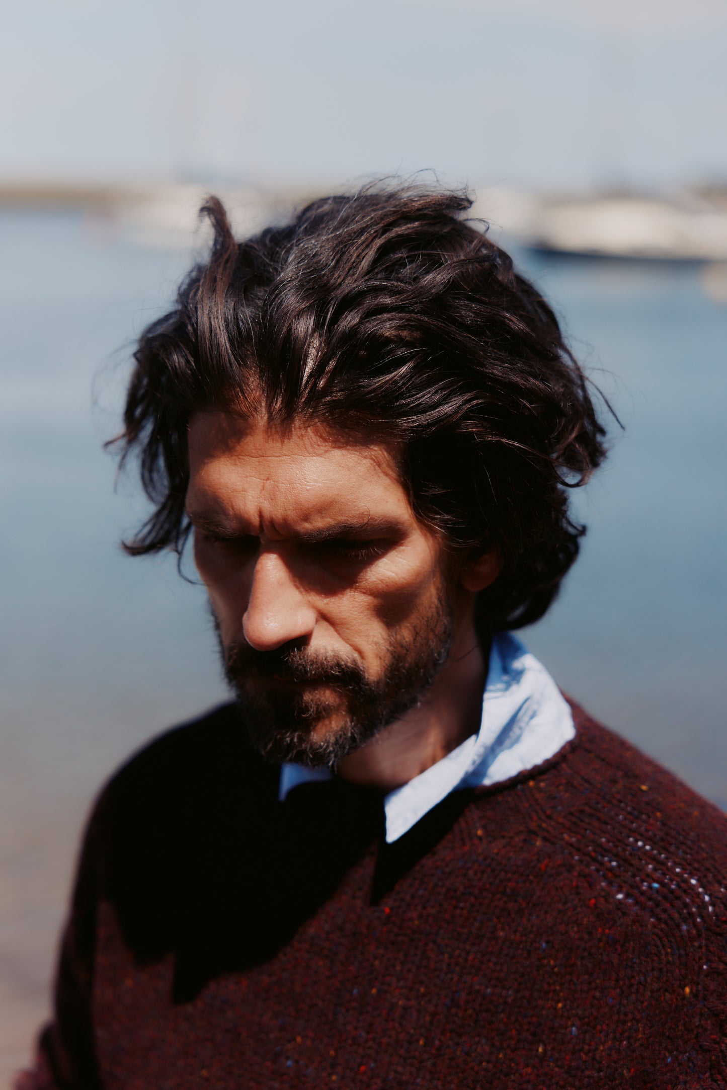 Model wearing a Bosie Knitwear Blue Mogganer Trawlerman Chunky Glenugie Nep Sweater in colour Lewis Dark Aubergine.