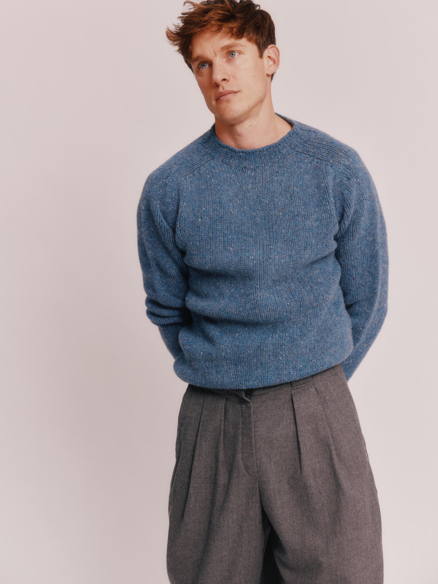 Model wearing a Bosie Knitwear Blue Mogganer Trawlerman Chunky Glenugie Nep Sweater in colour Ossian Blue.