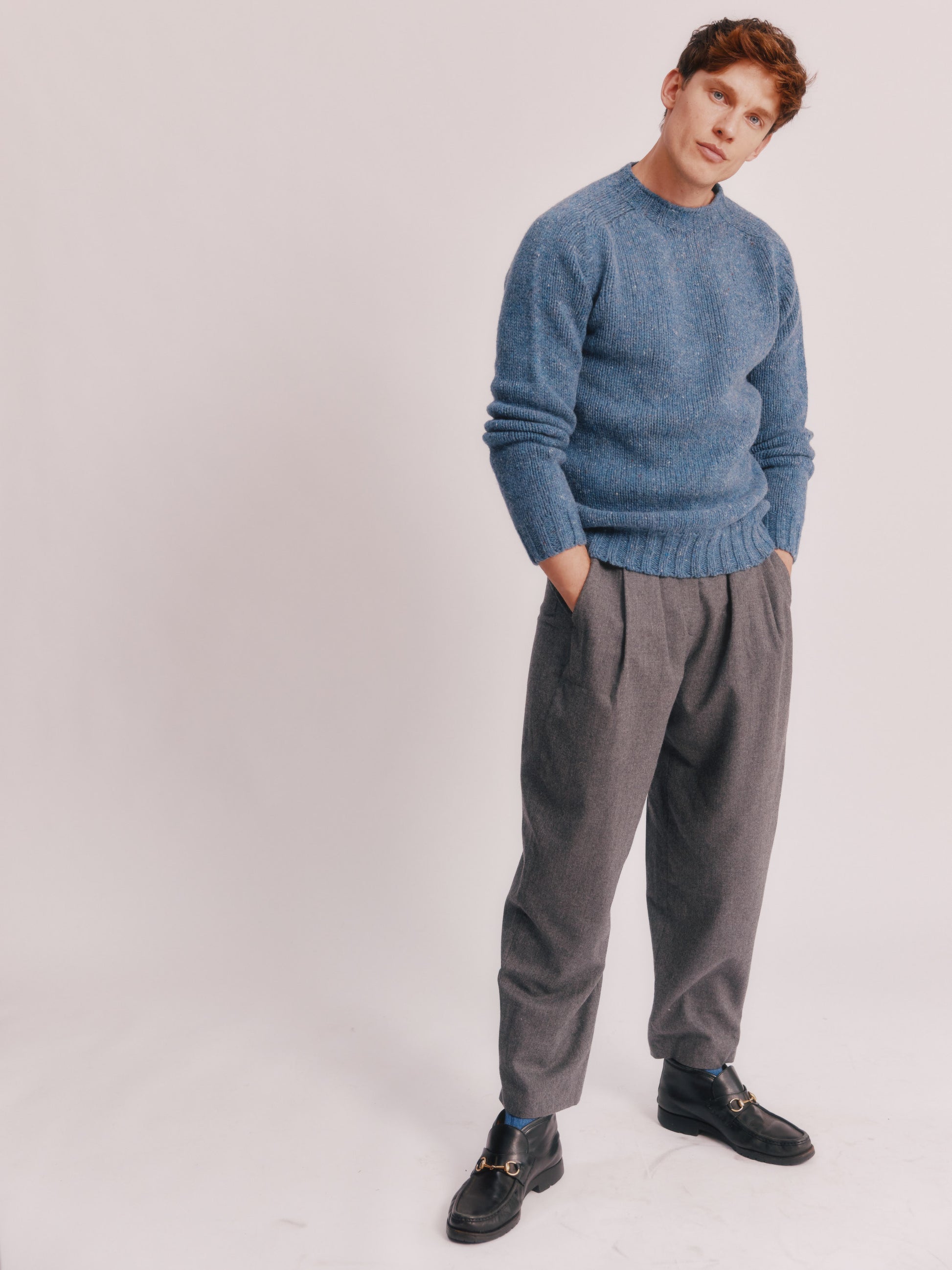 Model wearing a Bosie Knitwear Blue Mogganer Trawlerman Chunky Glenugie Nep Sweater in colour Ossian Blue.