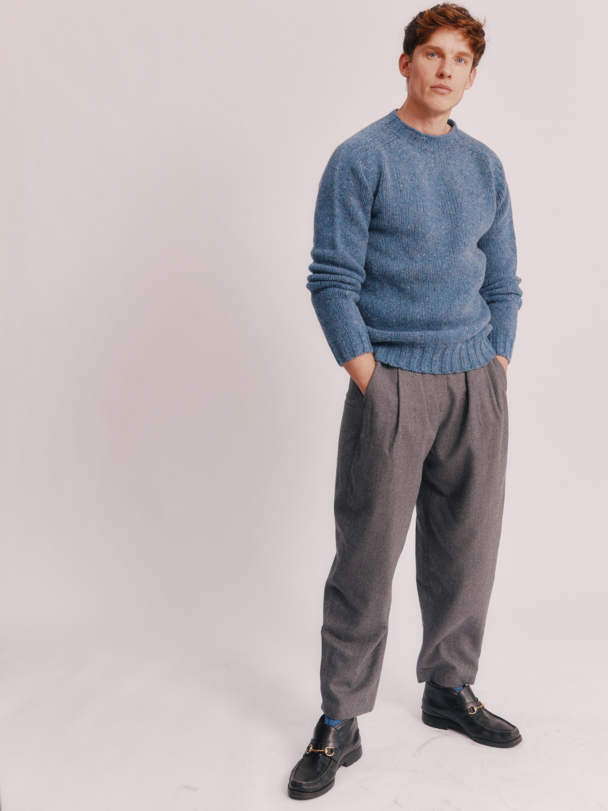 Model wearing a Bosie Knitwear Blue Mogganer Trawlerman Chunky Glenugie Nep Sweater in colour Ossian Blue.